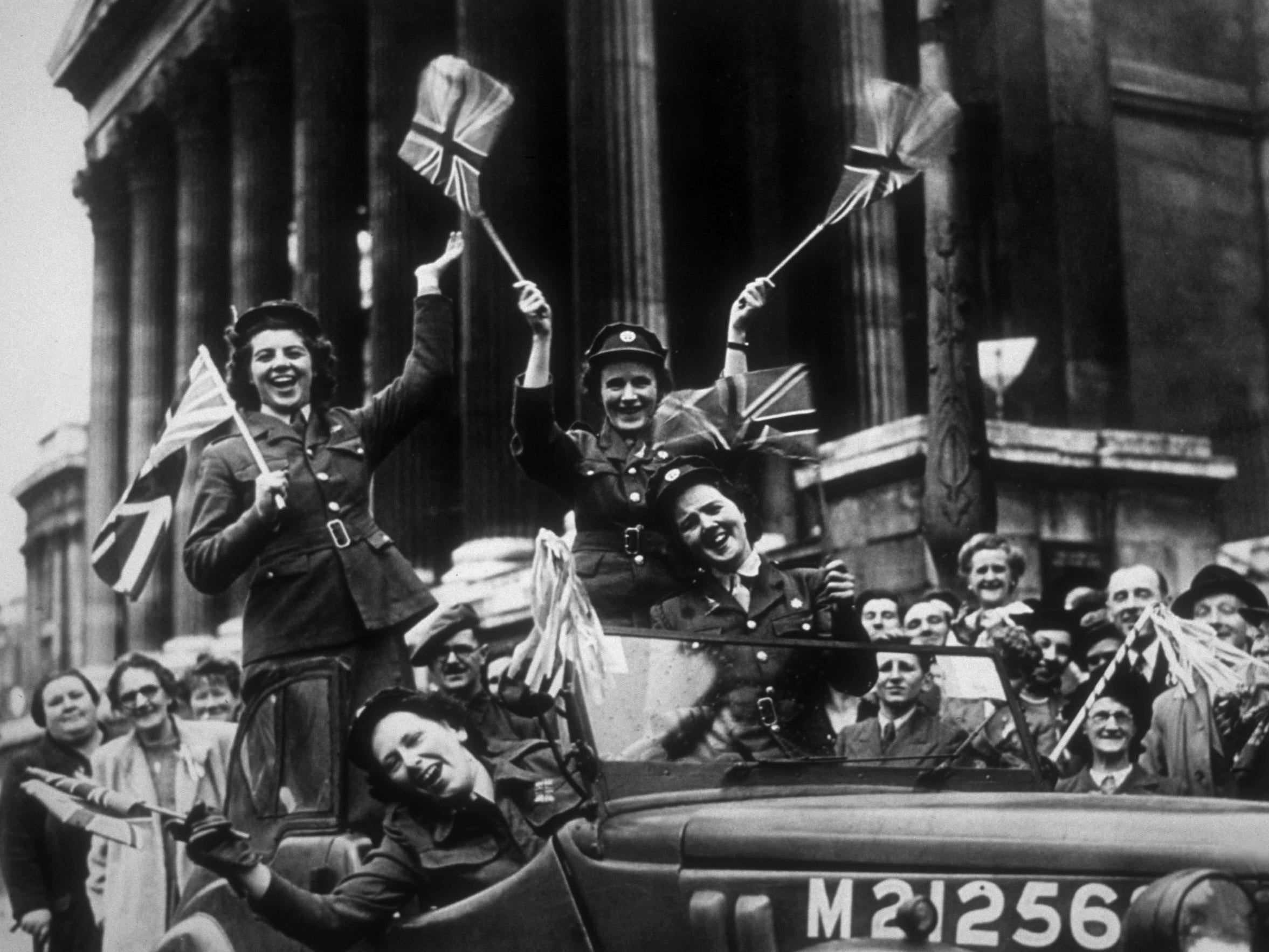 Members of the Auxiliary Territorial Service drive through Trafalgar Square during the celebrations in 1945