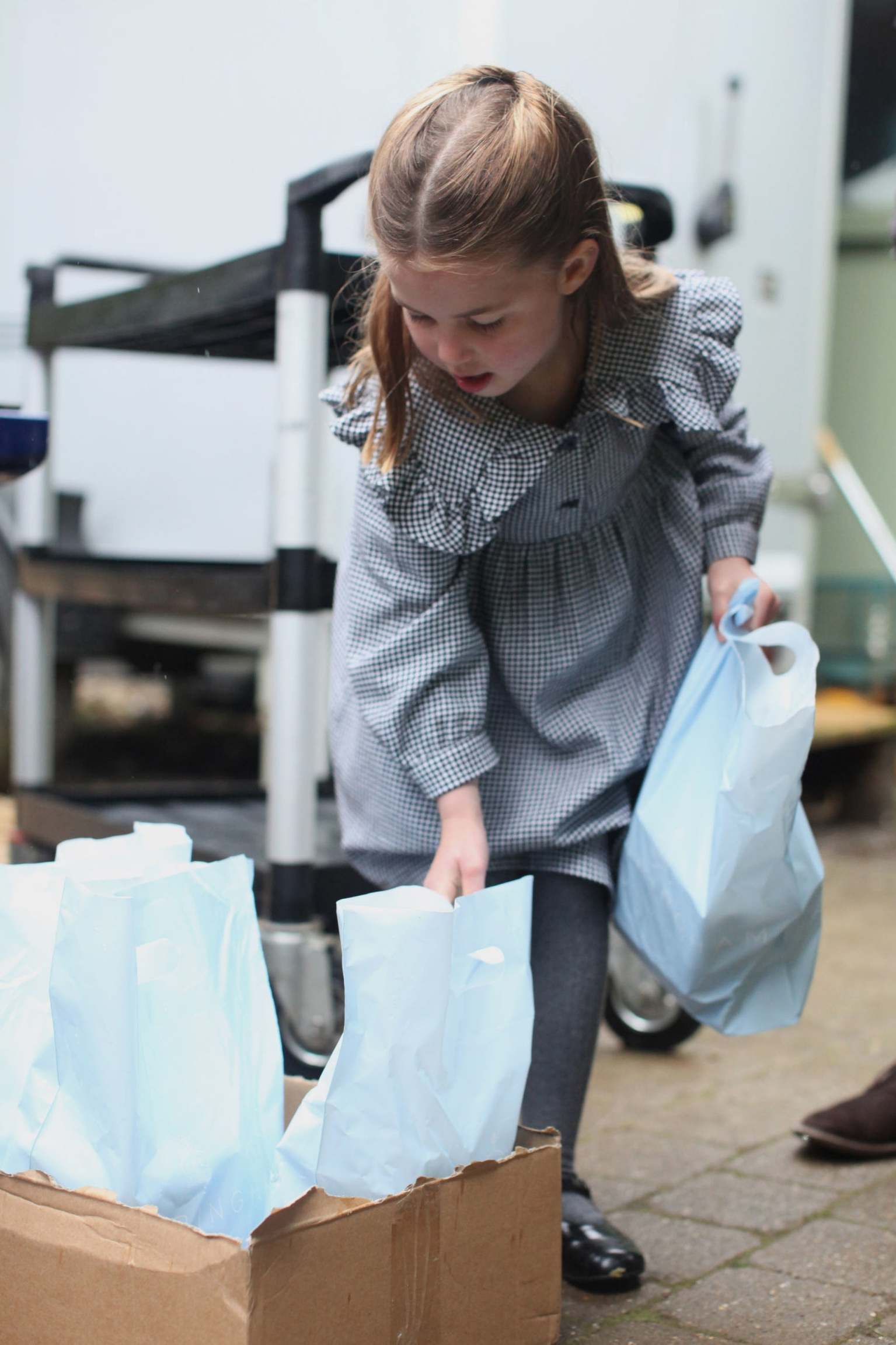 Princess Charlotte helps to pack up and deliver the packages.