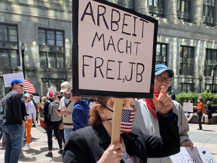 An anti-lockdown protester in Illinois brandished a Nazi slogan on Friday