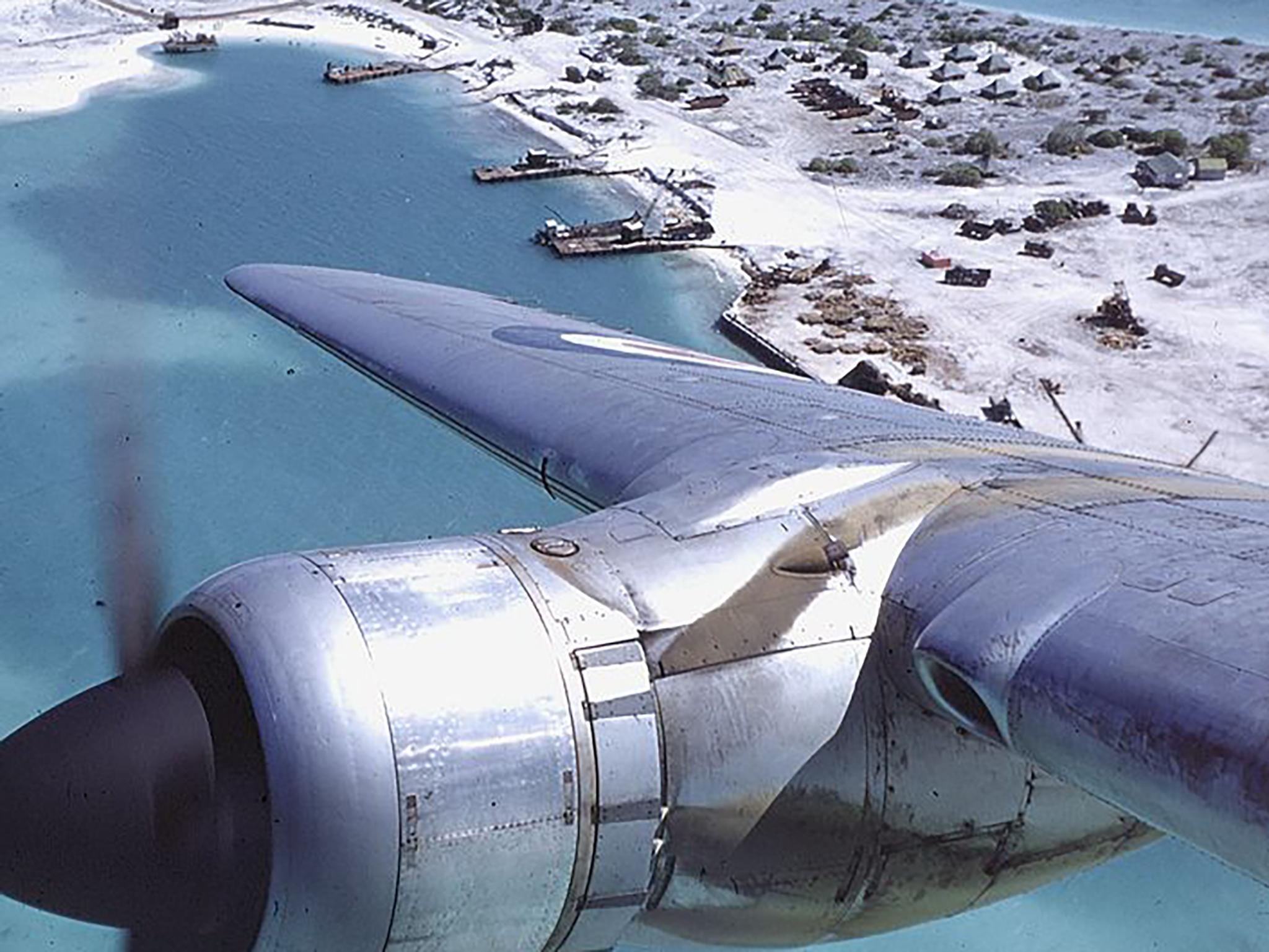 A British troop carrier flying over Christmas Island in 1956