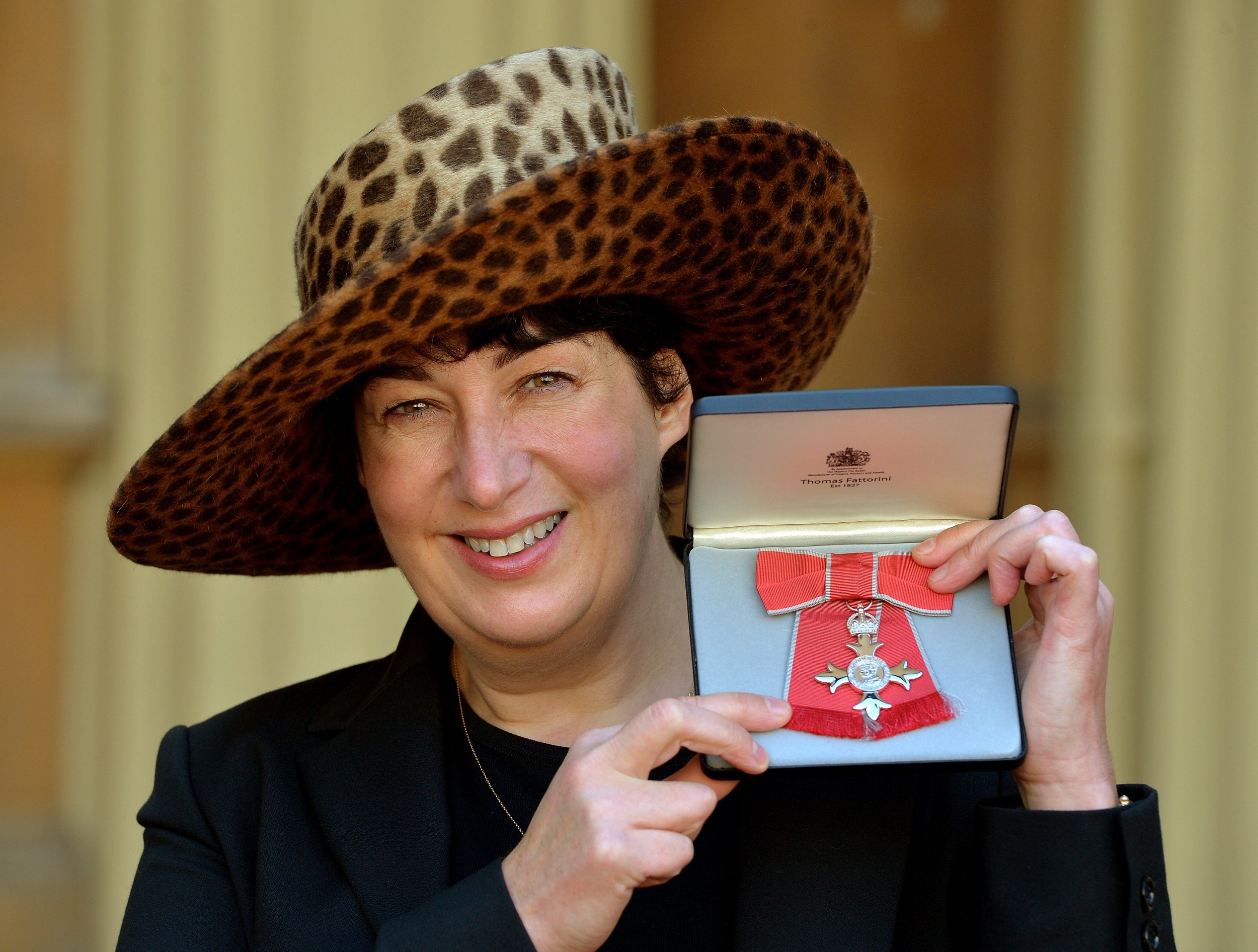 Harris with her MBE for Services to Literature