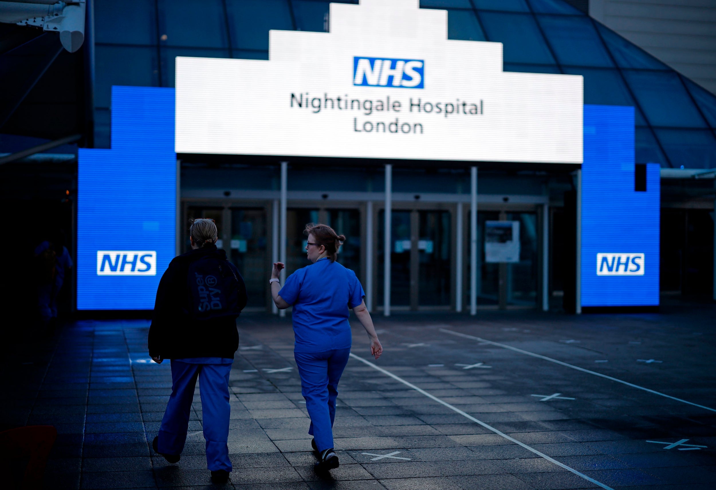 Staff outside the Excel exhibition centre, which was transformed into the Nightingale Hospital during the pandemic (AFP/Getty)