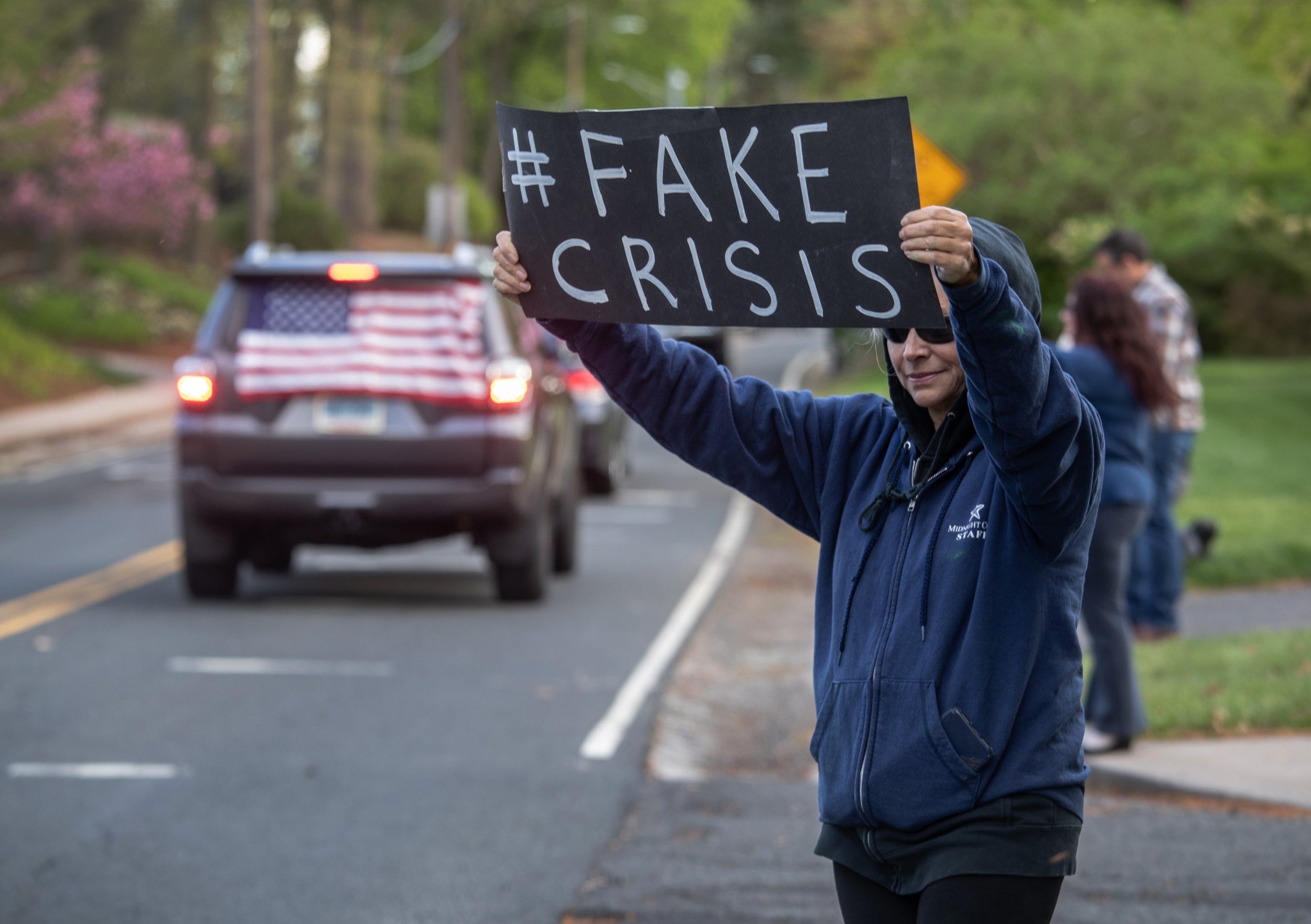 Demonstrators hold a ‘rolling car rally’ in front of Democratic governor Ned Lamont’s residence while protesting against the state’s stay-at-home order to combat the coronavirus pandemic (Getty)