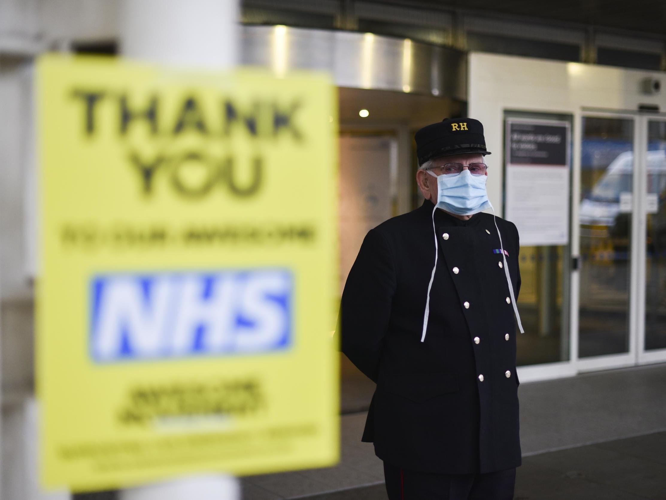 A Chelsea pensioner stands outside the Chelsea and Westminster Hospital last week wearing a protective mask due to the coronavirus outbreak.