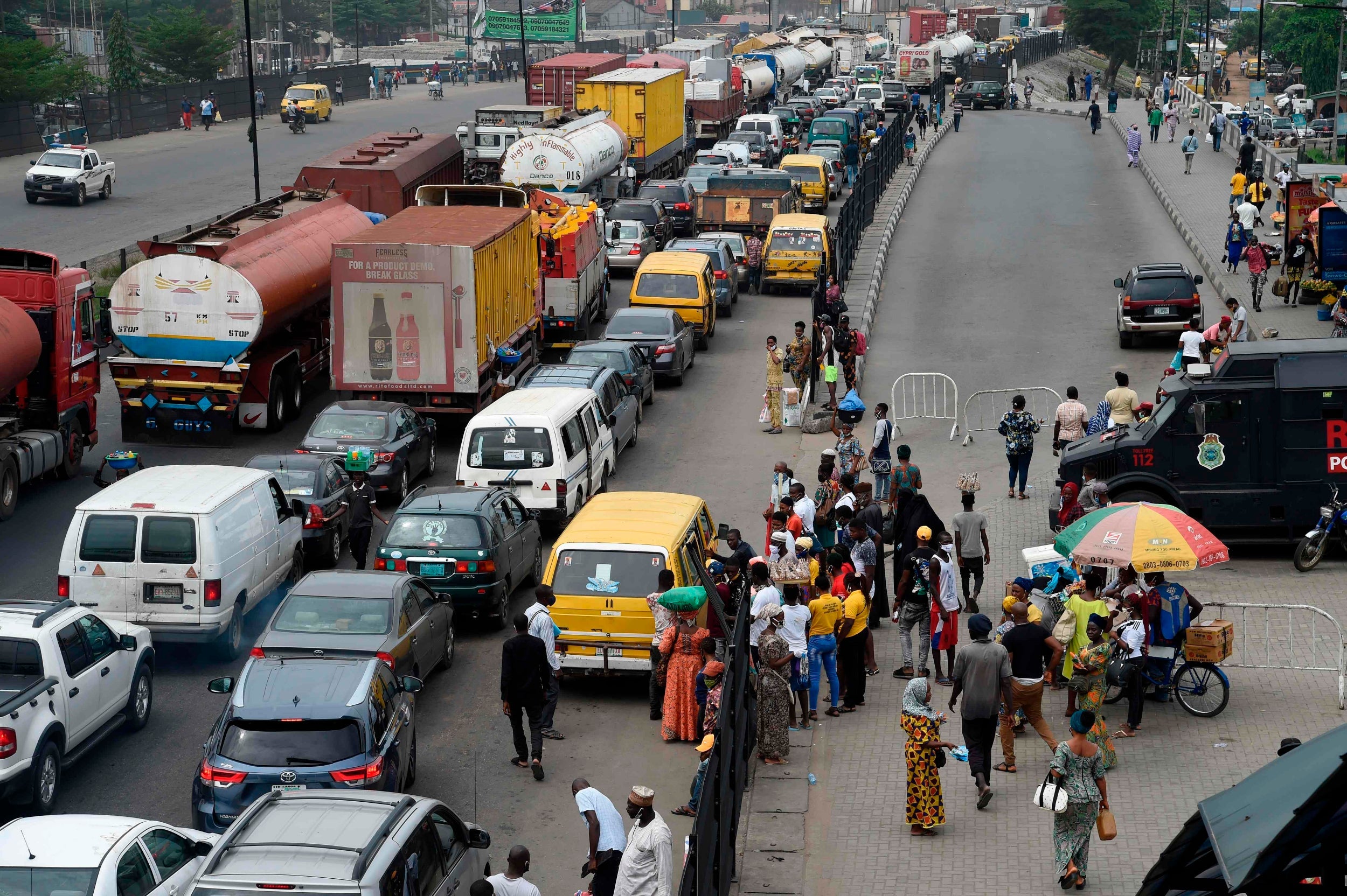 Motorists queue in a traffic gridlock as commercial activities return at the end of a five-week coronavirus lockdown