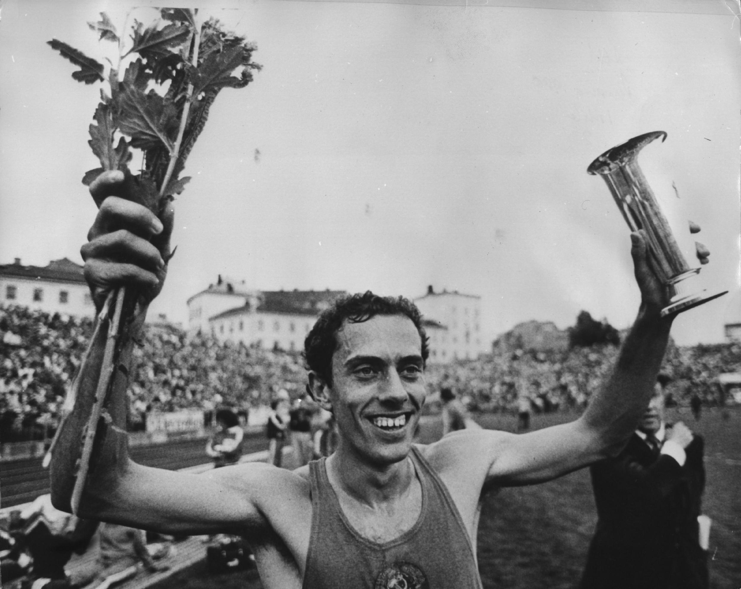 Ovett holds his trophy high after his world record in the mile in Oslo, taking the record from Sebastian Coe (Getty)