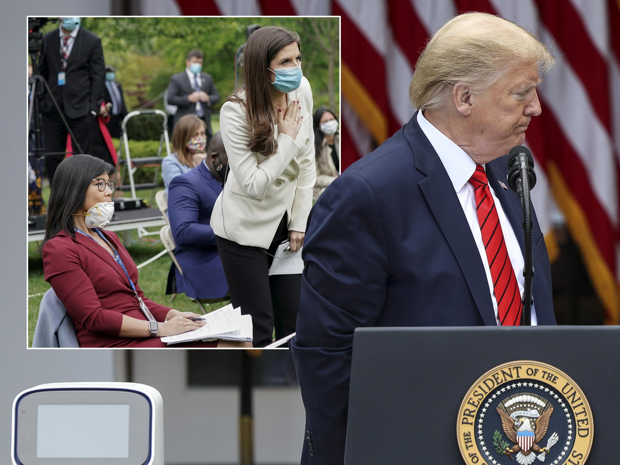 CBS News correspondent Weijia Jiang (left, seated) as her question leads to Trump leaving his press briefing early