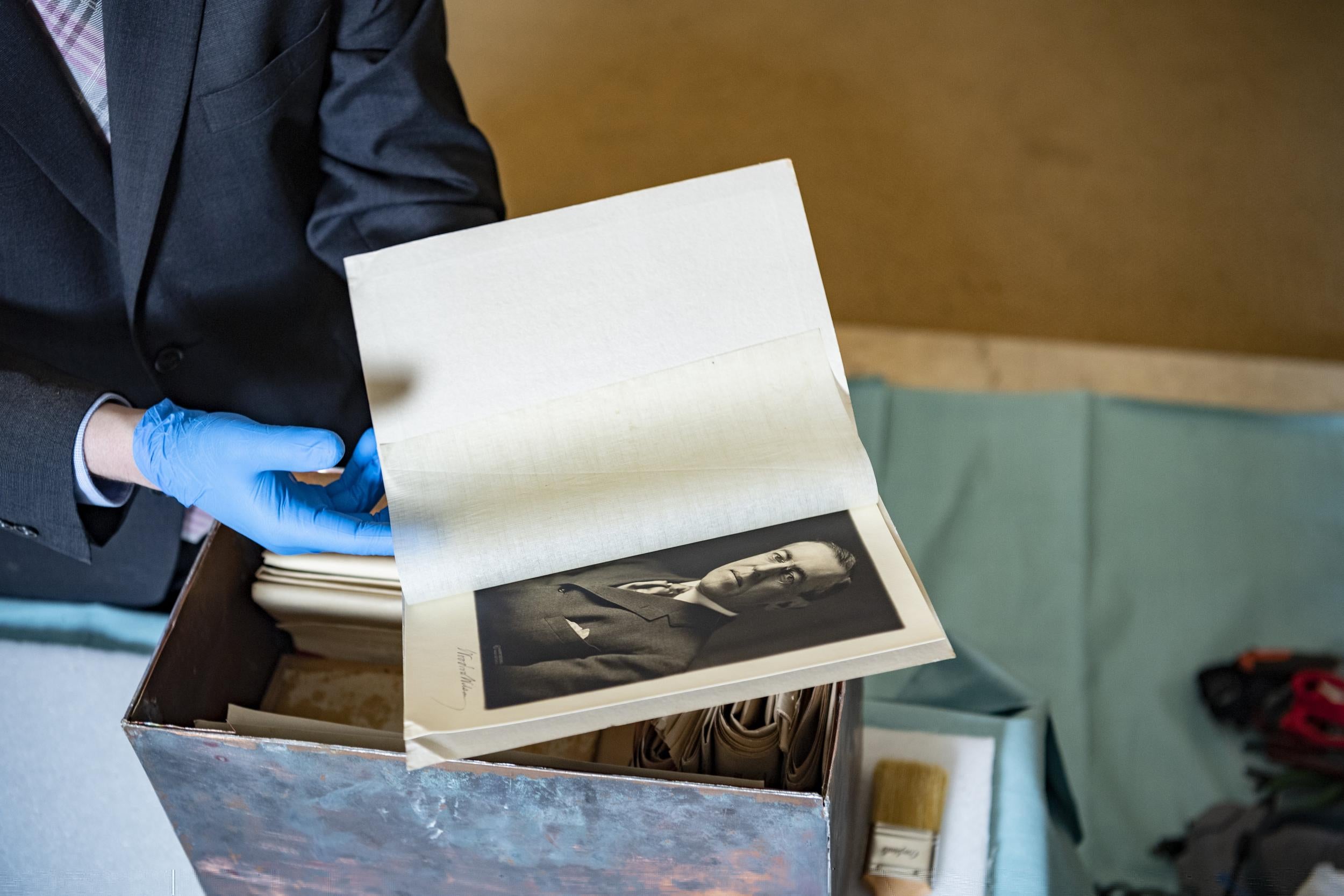 Tim Frank holds a signed photograph of President Woodrow Wilson removed from a time capsule at Arlington National Cemetery