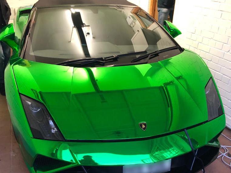 A green Lamborghini seized following county lines drug dealing raids in London on 12 May