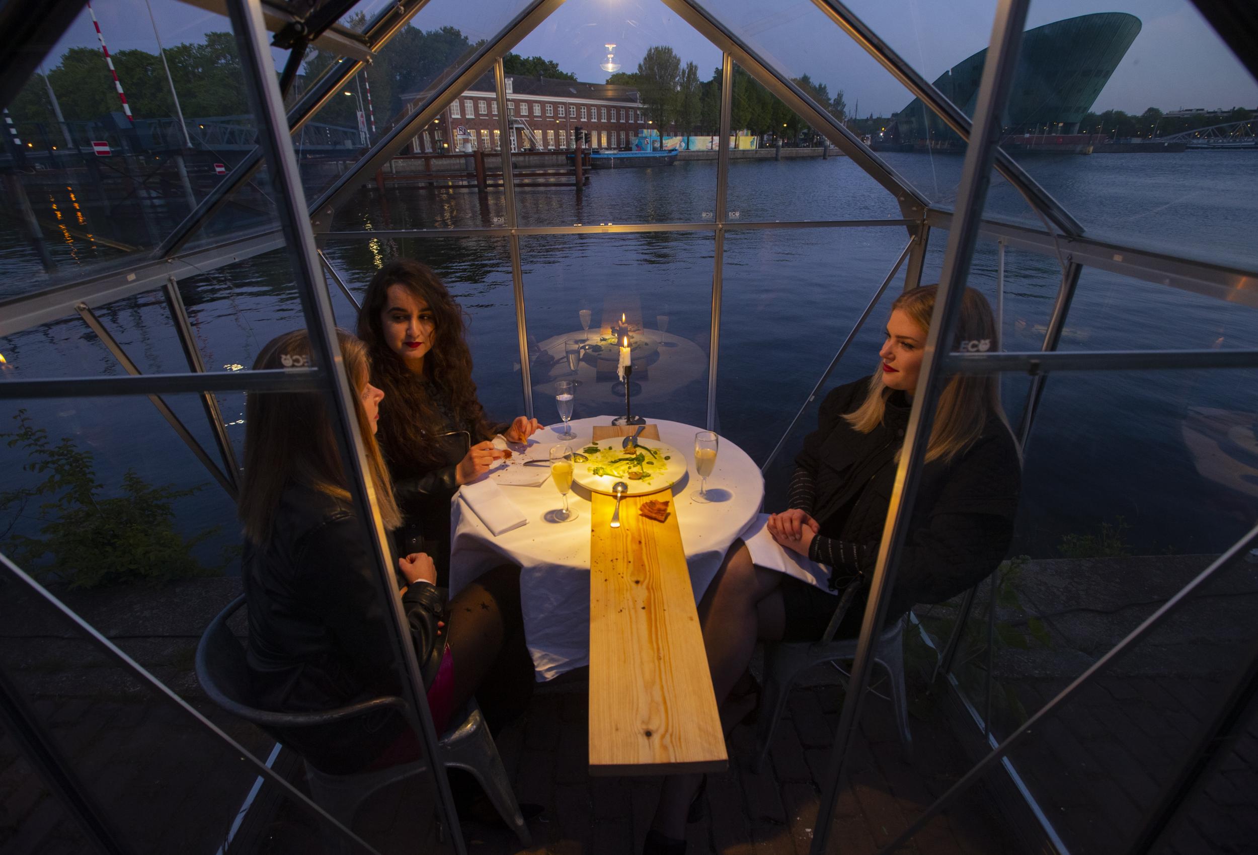 Up to three people can sit in the greenhouses