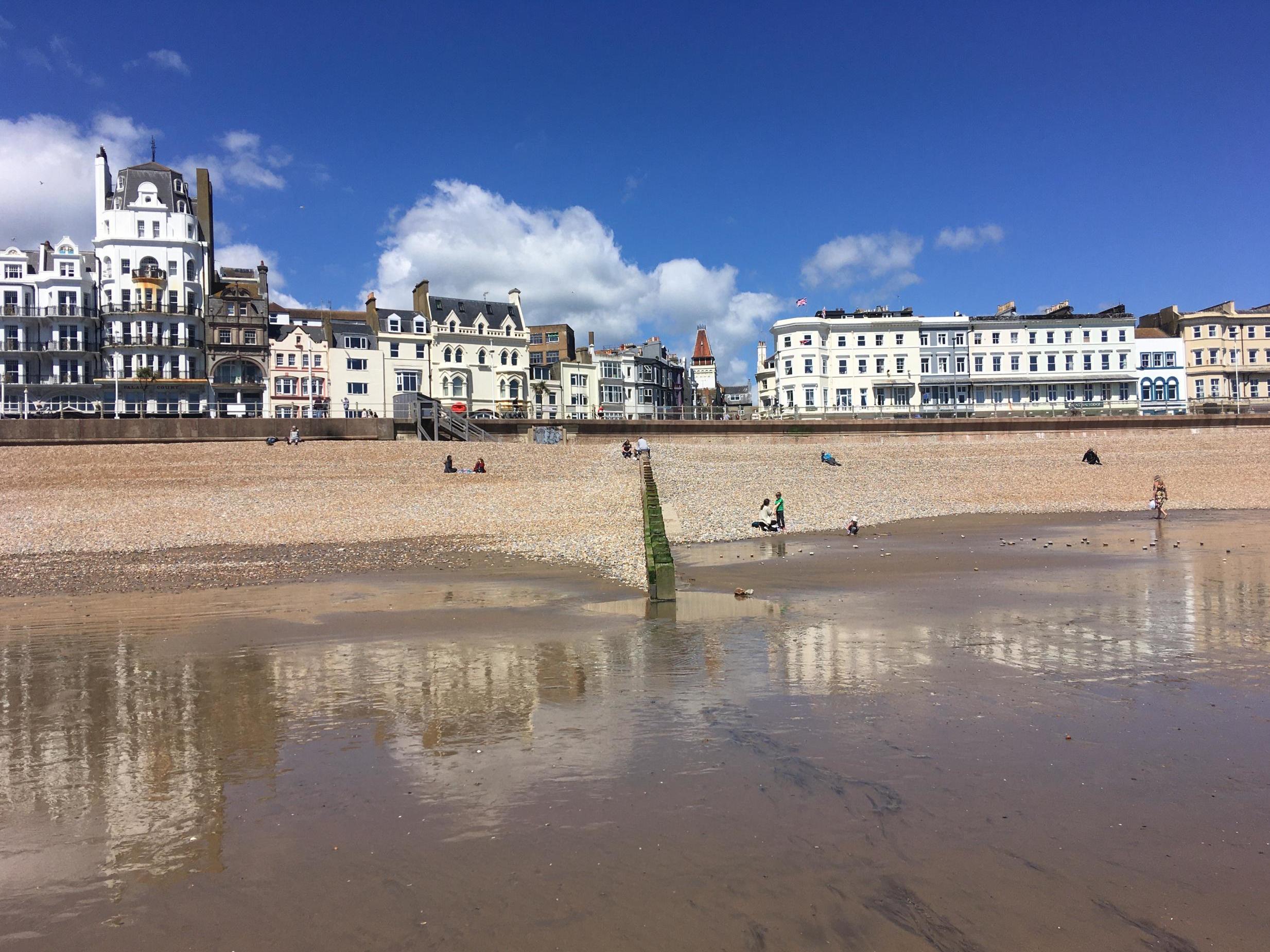 Hastings beach remains relatively quiet despite warm sunny weather