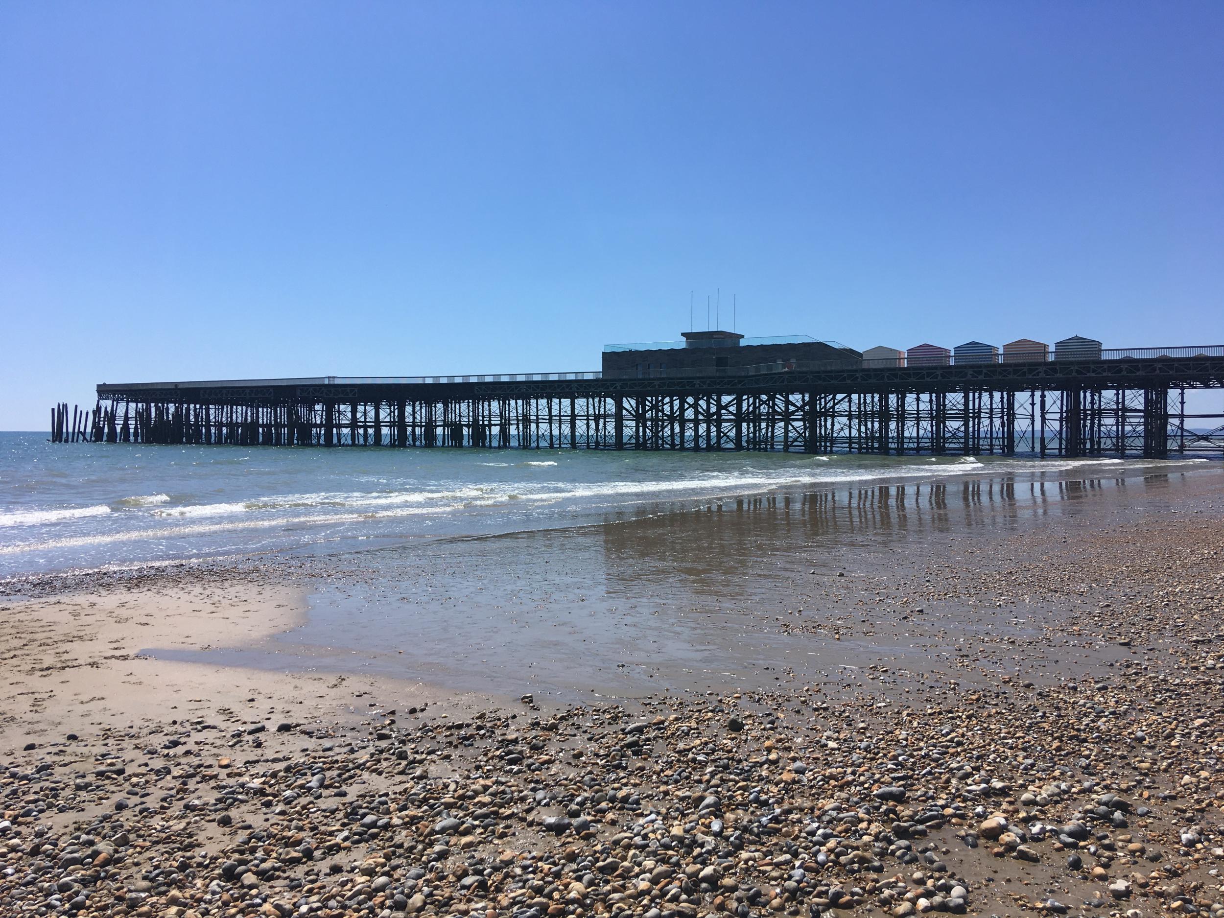 Hastings Pier is closed and the beach almost empty