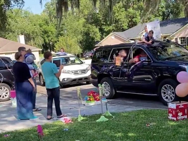 Members of the community participated in a socially distanced parade to celebrate Isla's adoption