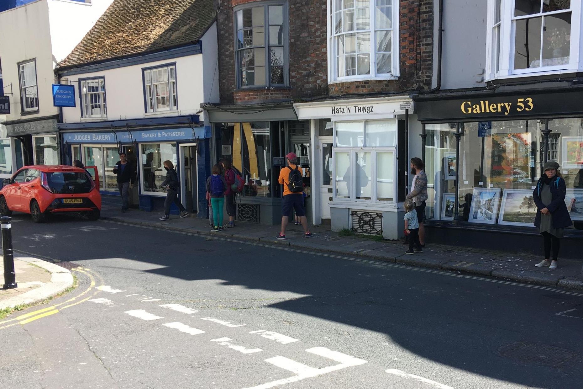 People queueing to go into Judges Bakery in the old town on Hastings High Street