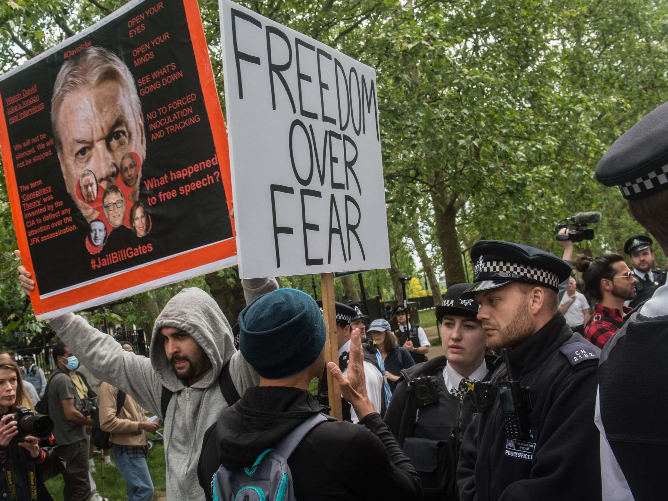 Police speak to a protester as conspiracy theorists gather at Hyde Park Corner on 16 May 2020 in London