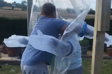 Man creates ‘cuddle curtain’ to hug his grandmother