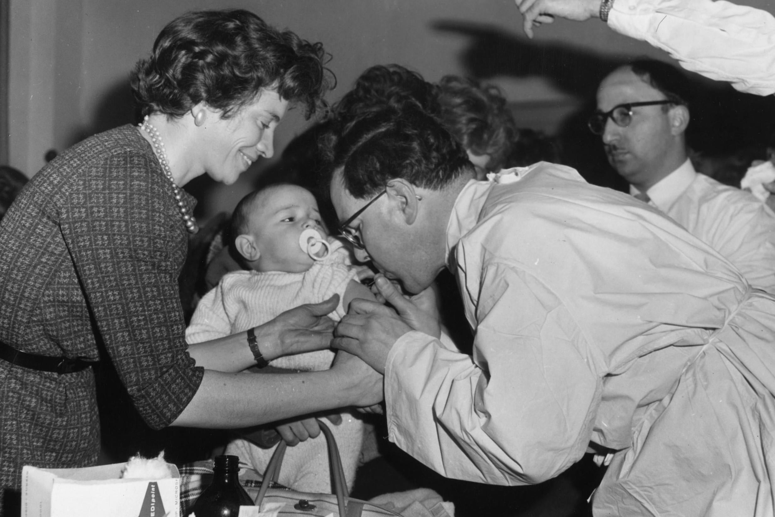 A baby is vaccinated in St Pancras town hall