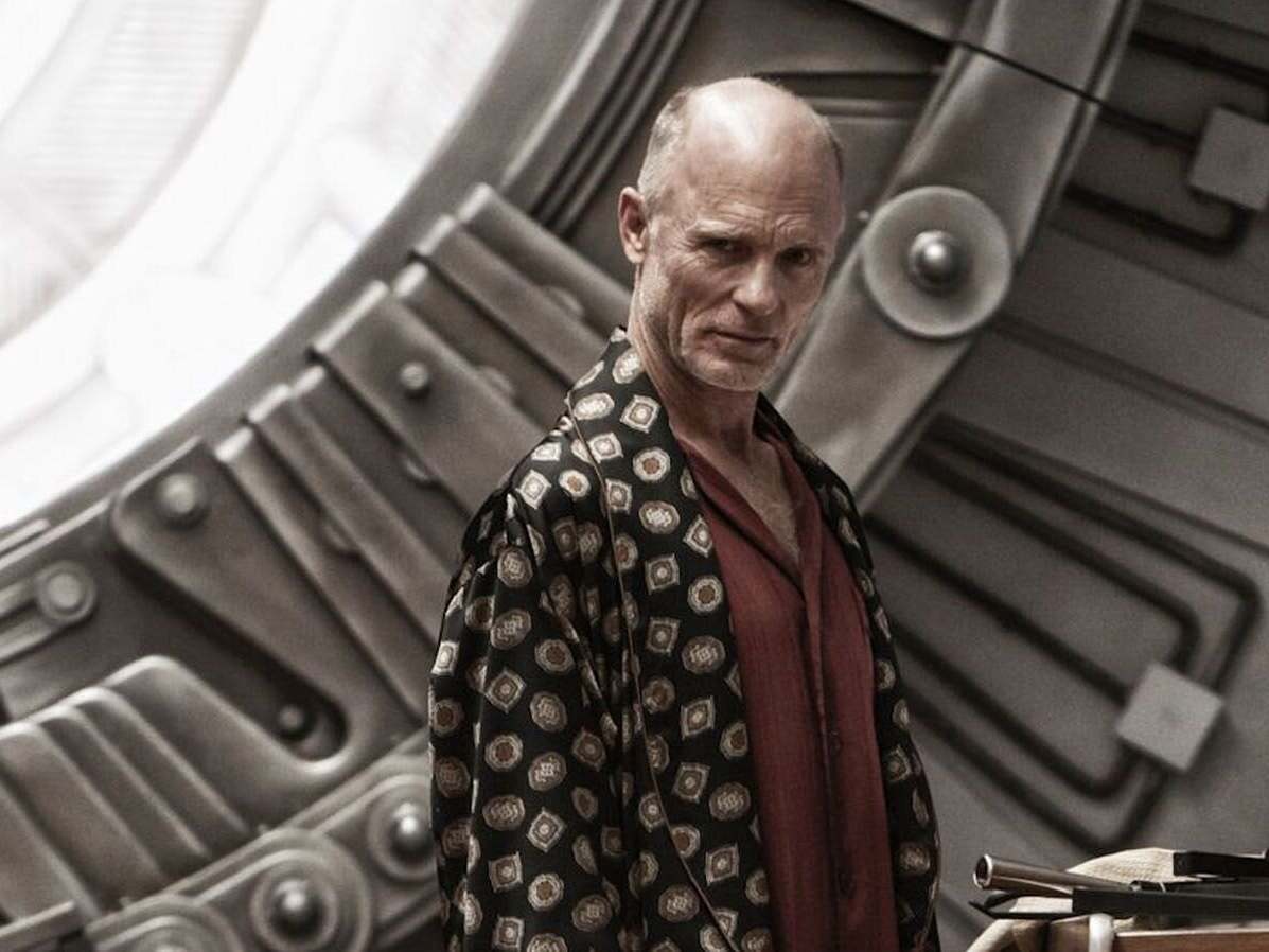 Ed Harris’s Wilford possesses the charisma of a cult leader and the mystique of an otherworldly sage