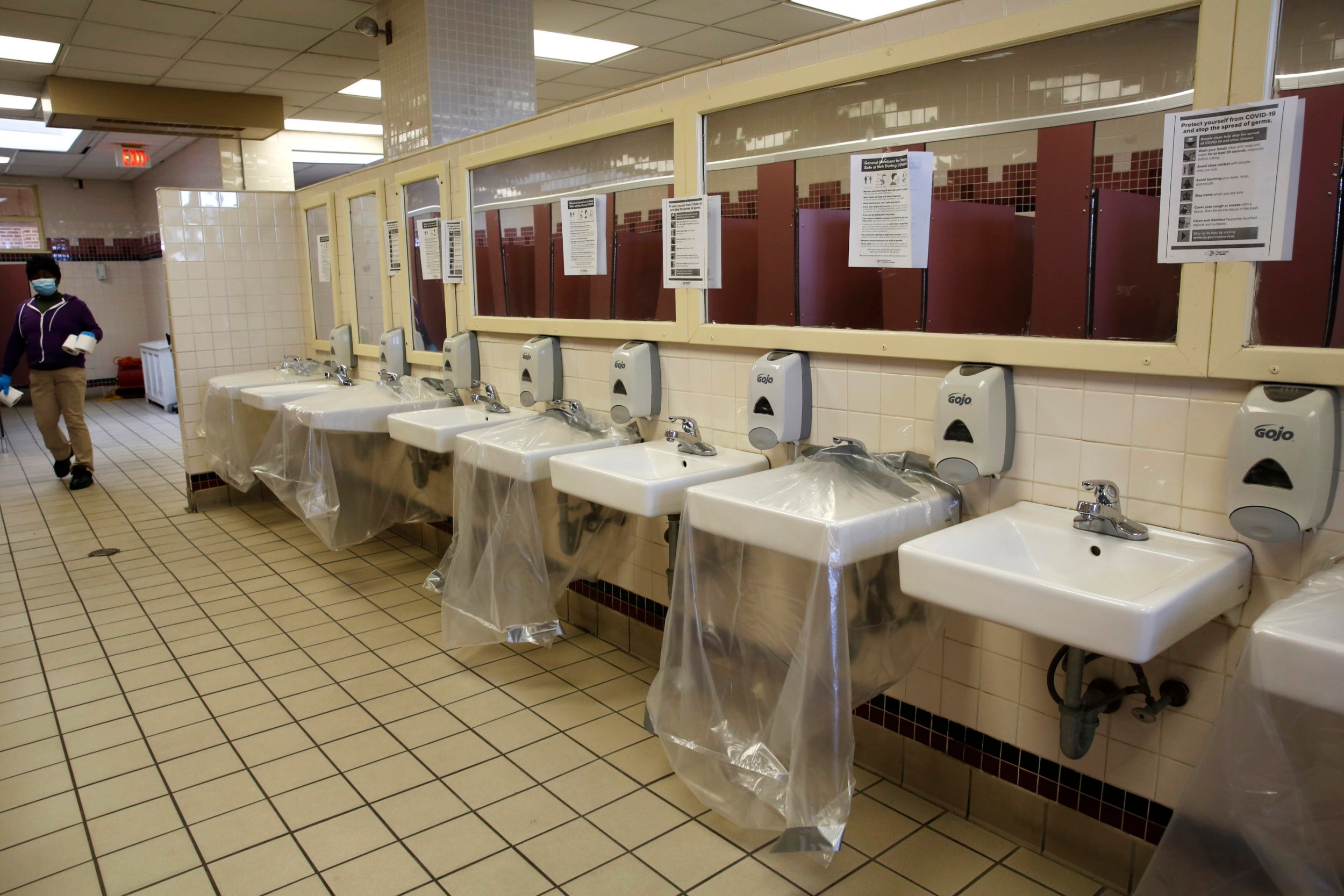 Sinks are covered to prevent people standing too close to each other