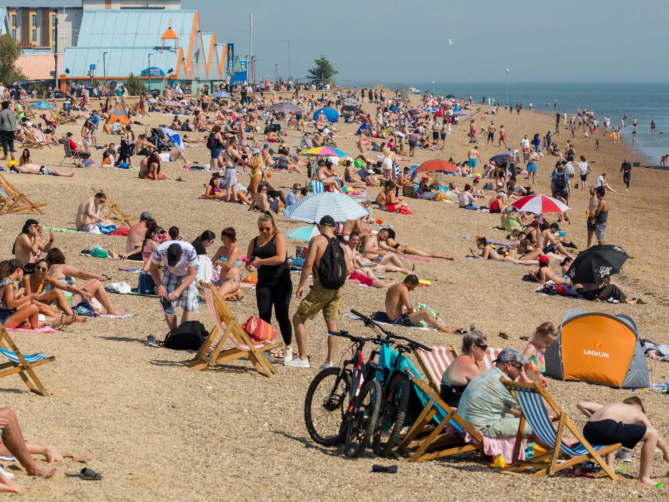 People visiting Southend beach during hot and sunny weather in Essex on 21 May