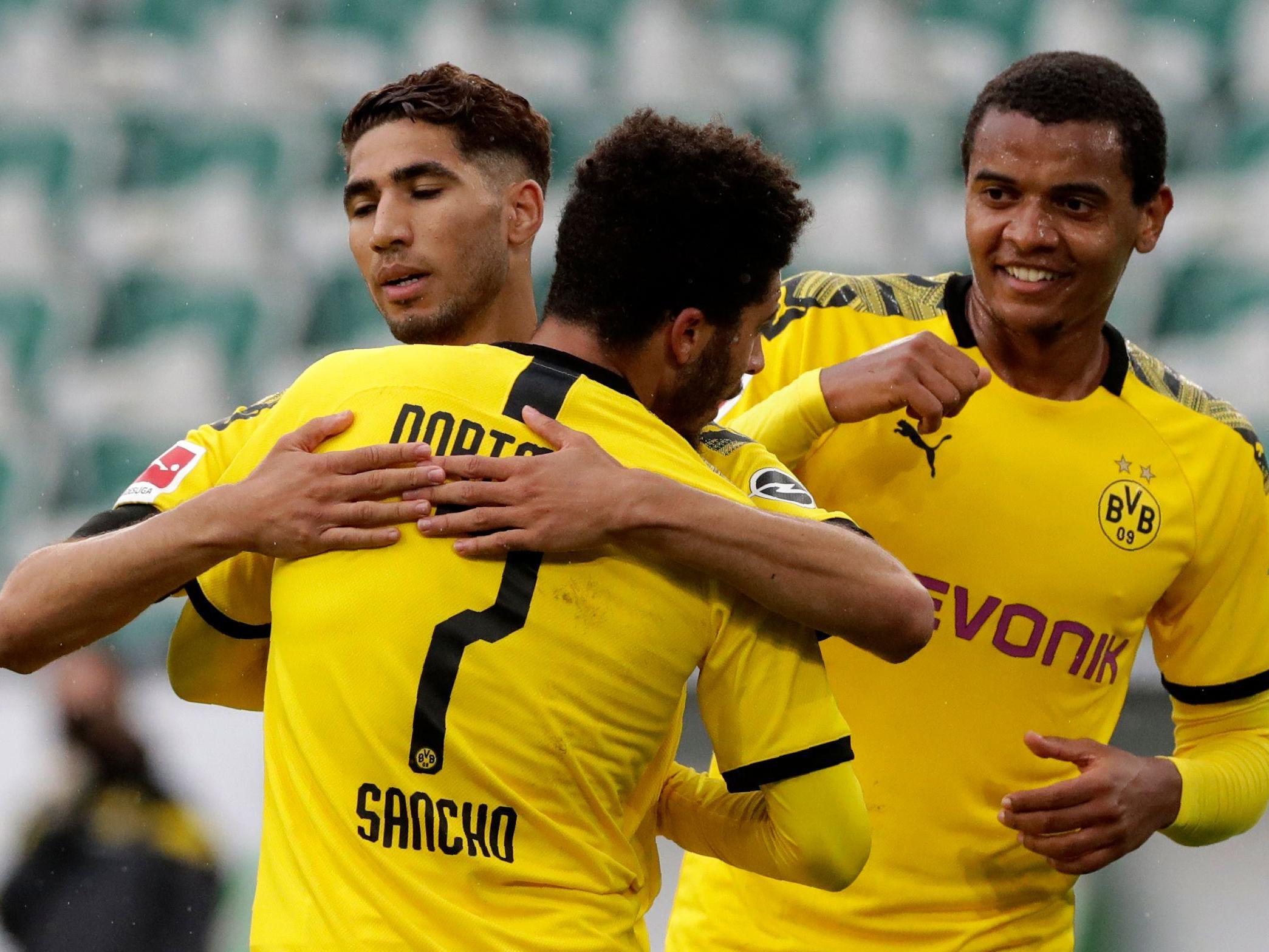 Borussia Dortmund's Achraf Hakim celebrates with Jadon Sancho