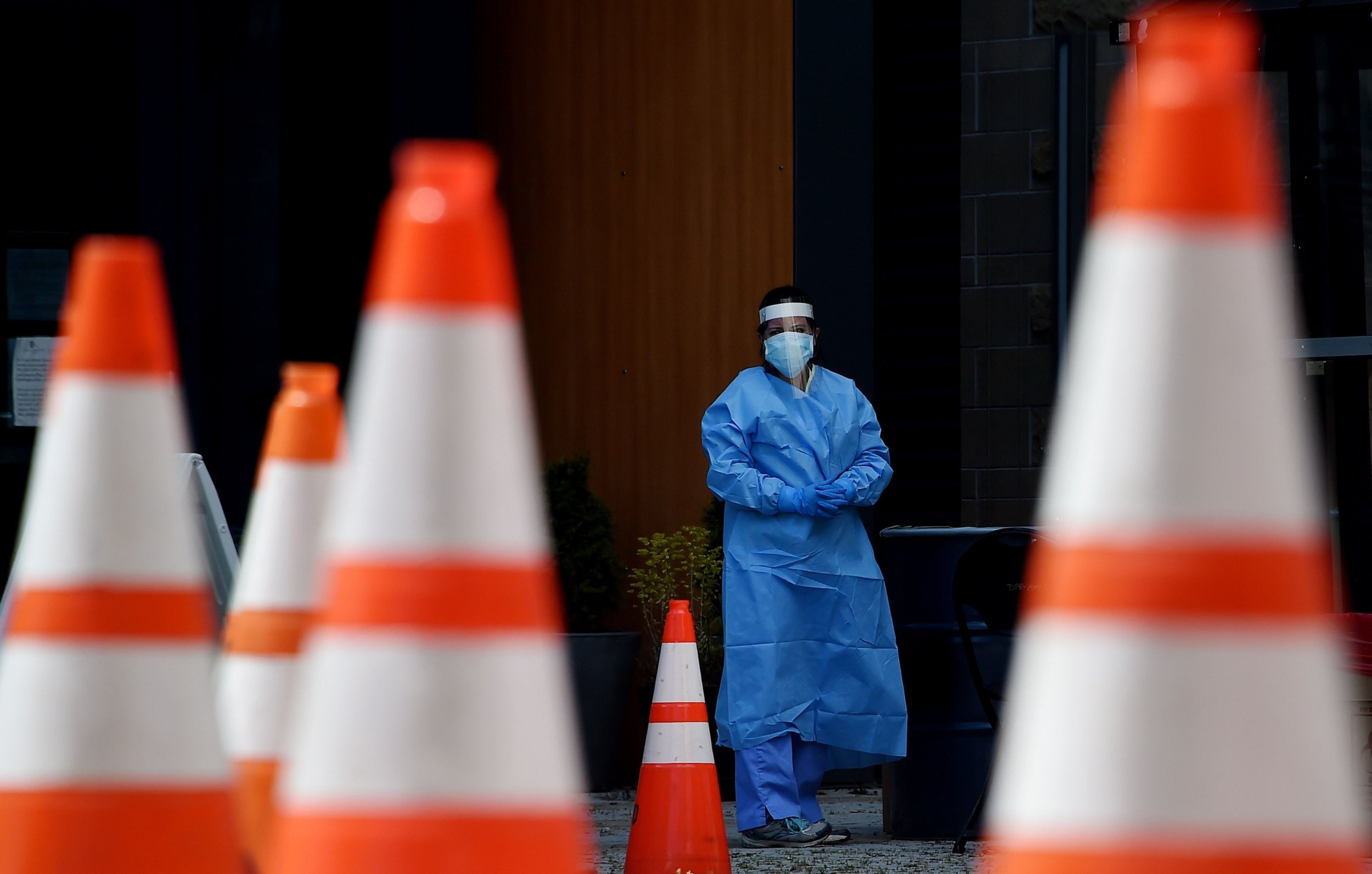 Healthcare workers wait for patients to be tested at a walk-in Covid-19 testing site on 12 May, 2020, in Arlington, Virginia