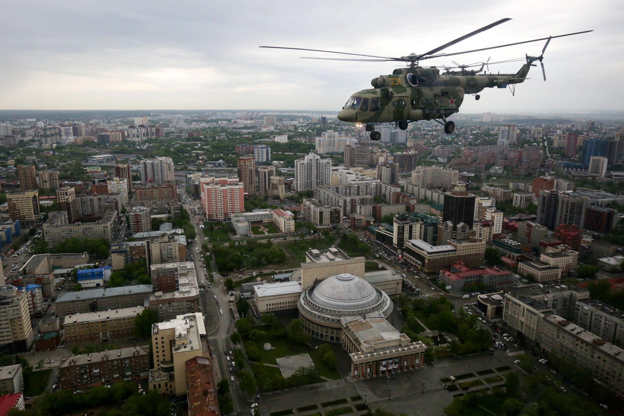 A Russian Mi-8 helicopter flies over Novosibirsk