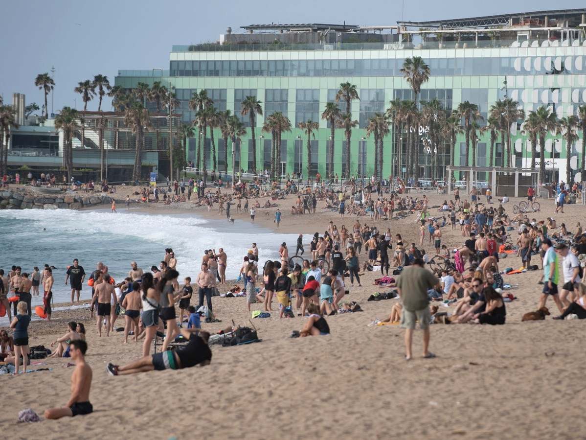 People at La Barceloneta Beach in Barcelona on May 24, 2020