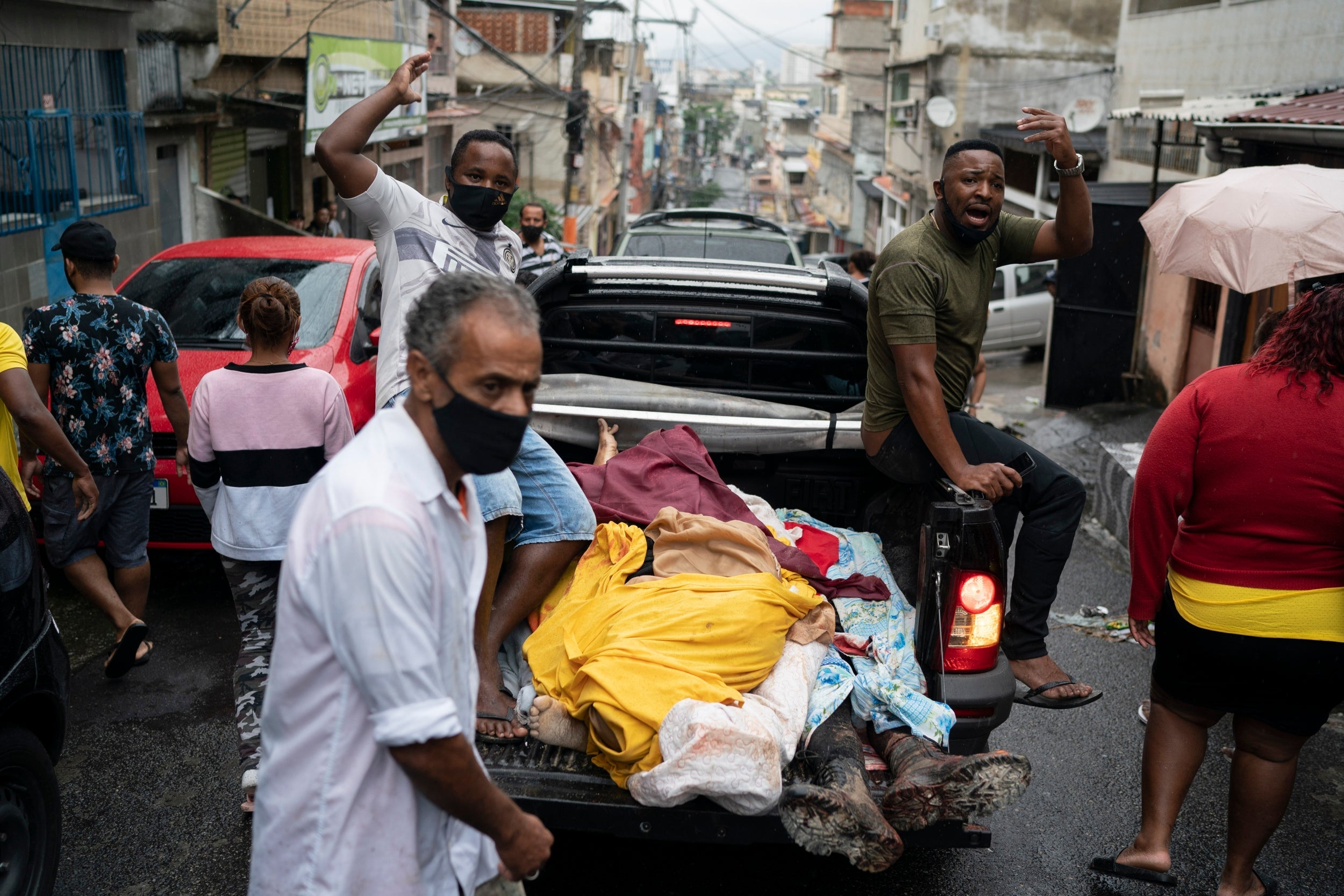 Bodies are transported following a deadly confrontation in Rio