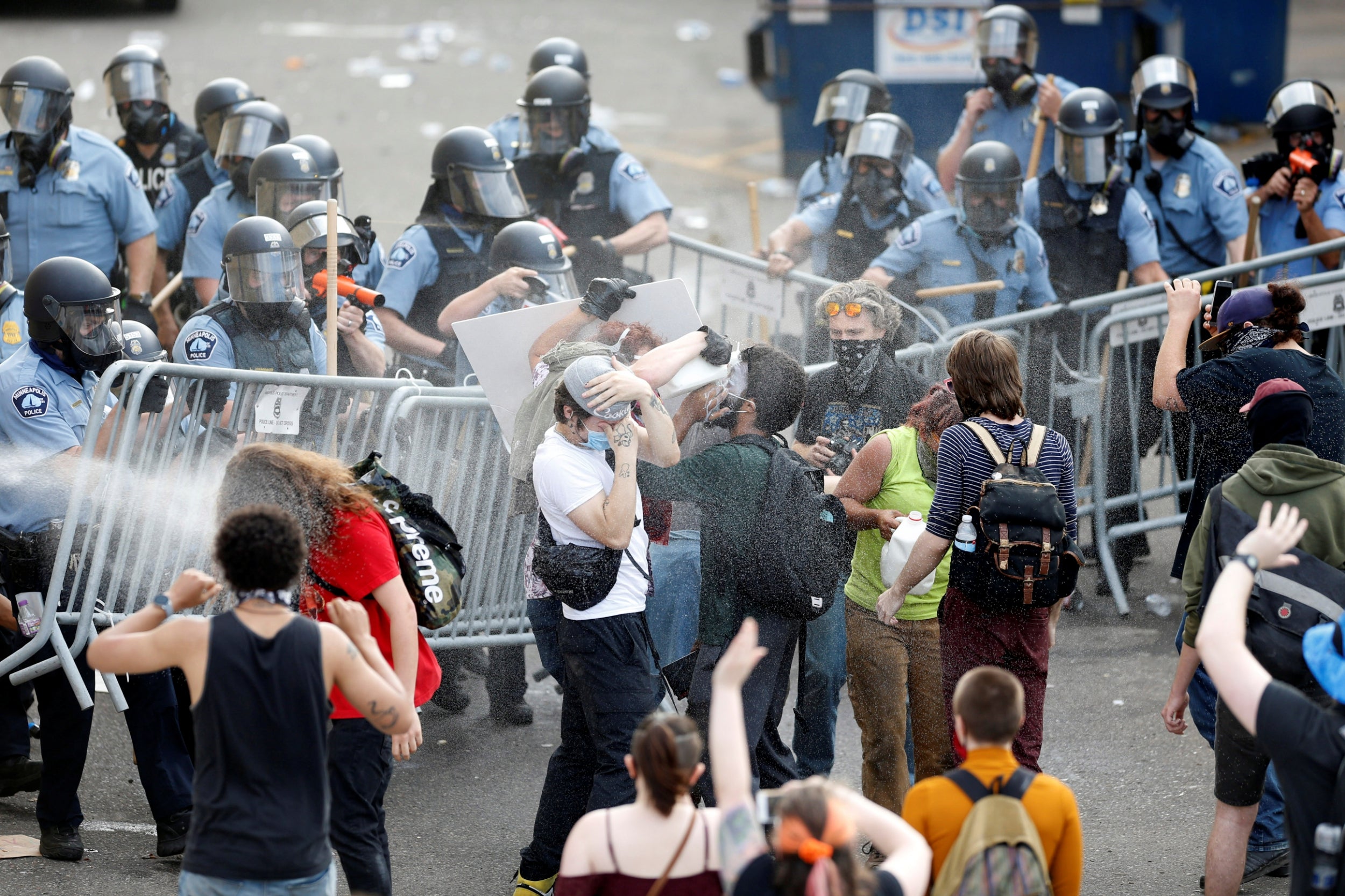 Police spray mace at protestors to break up a gathering near the Minneapolis Police third precinct after a white police officer was caught on a bystander's video pressing his knee into the neck of African-American man George Floyd, who later died at a hospital, in Minneapolis
