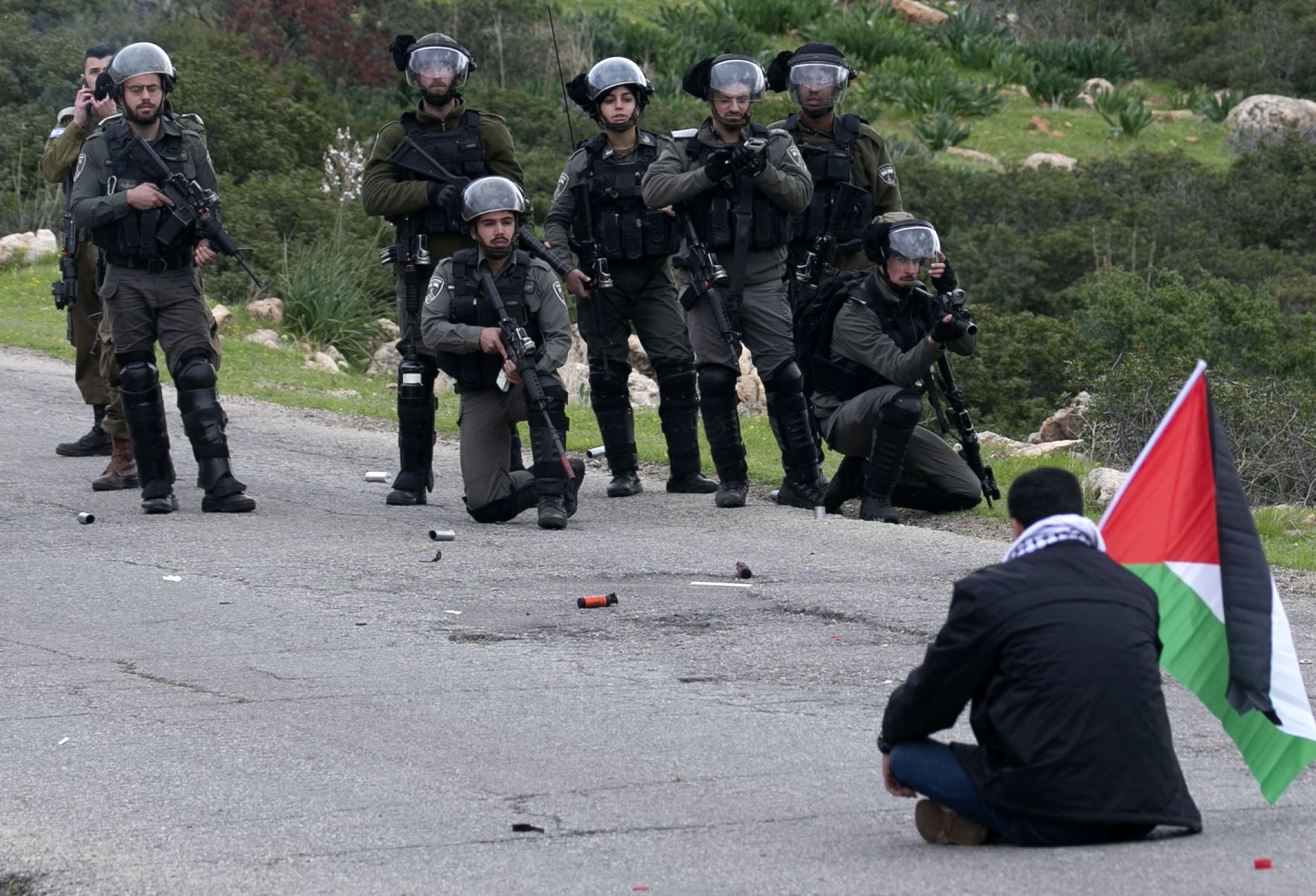 Palestinian protester opposite Israeli forces during clashes over settlements in the Jordan Valley, 25 February 2020 (Jaafar Ashtiyeh / AFP via Getty Images)