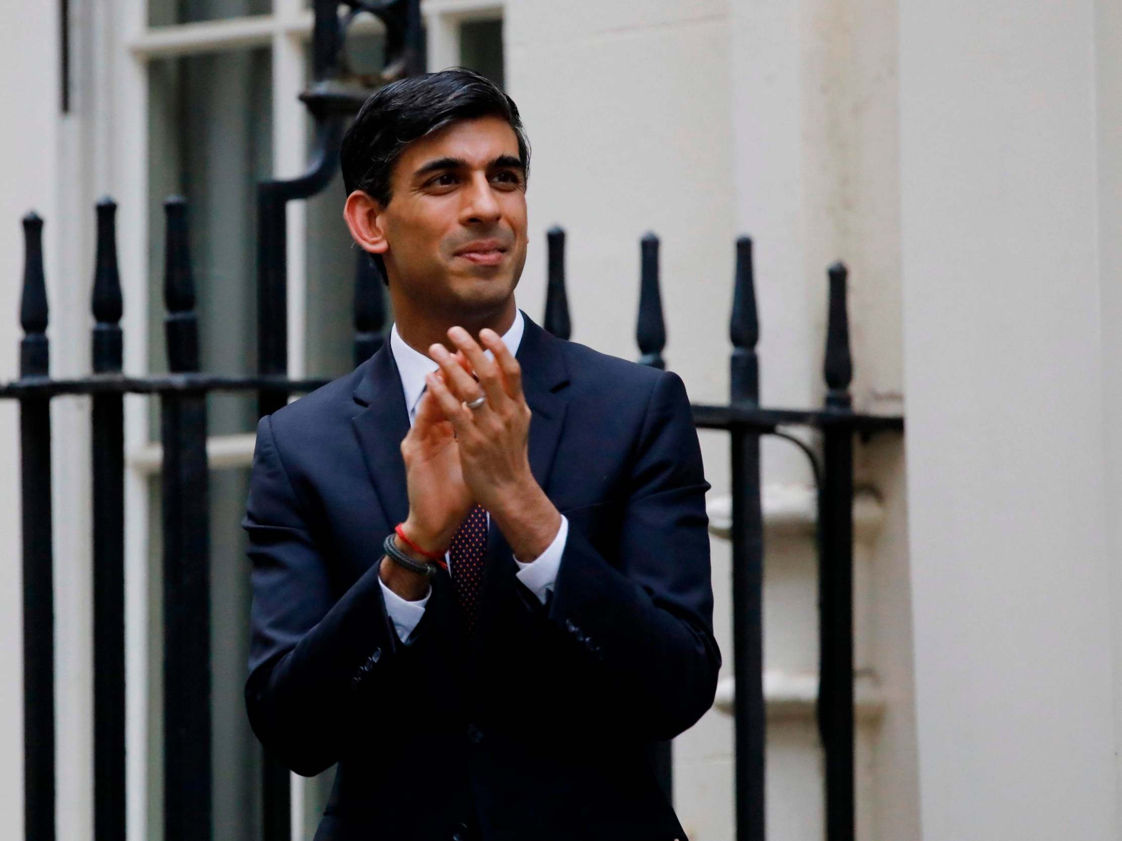 Rishi Sunak participates in a national "clap for carers" to show thanks for the work of NHS workers during the pandemic last year