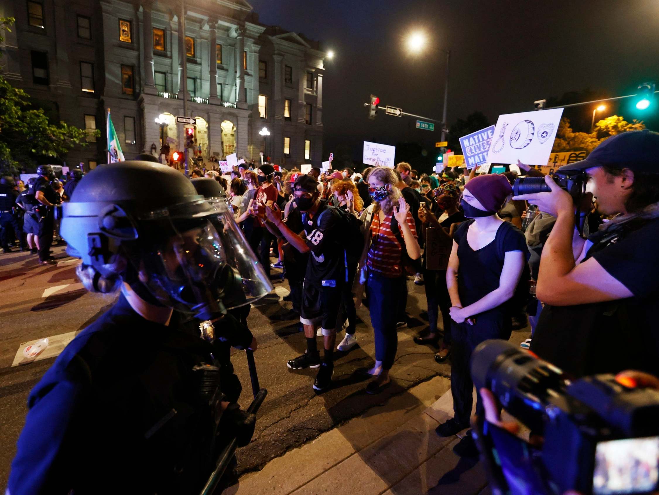 Denver police face off with protesters outside the State Capitol