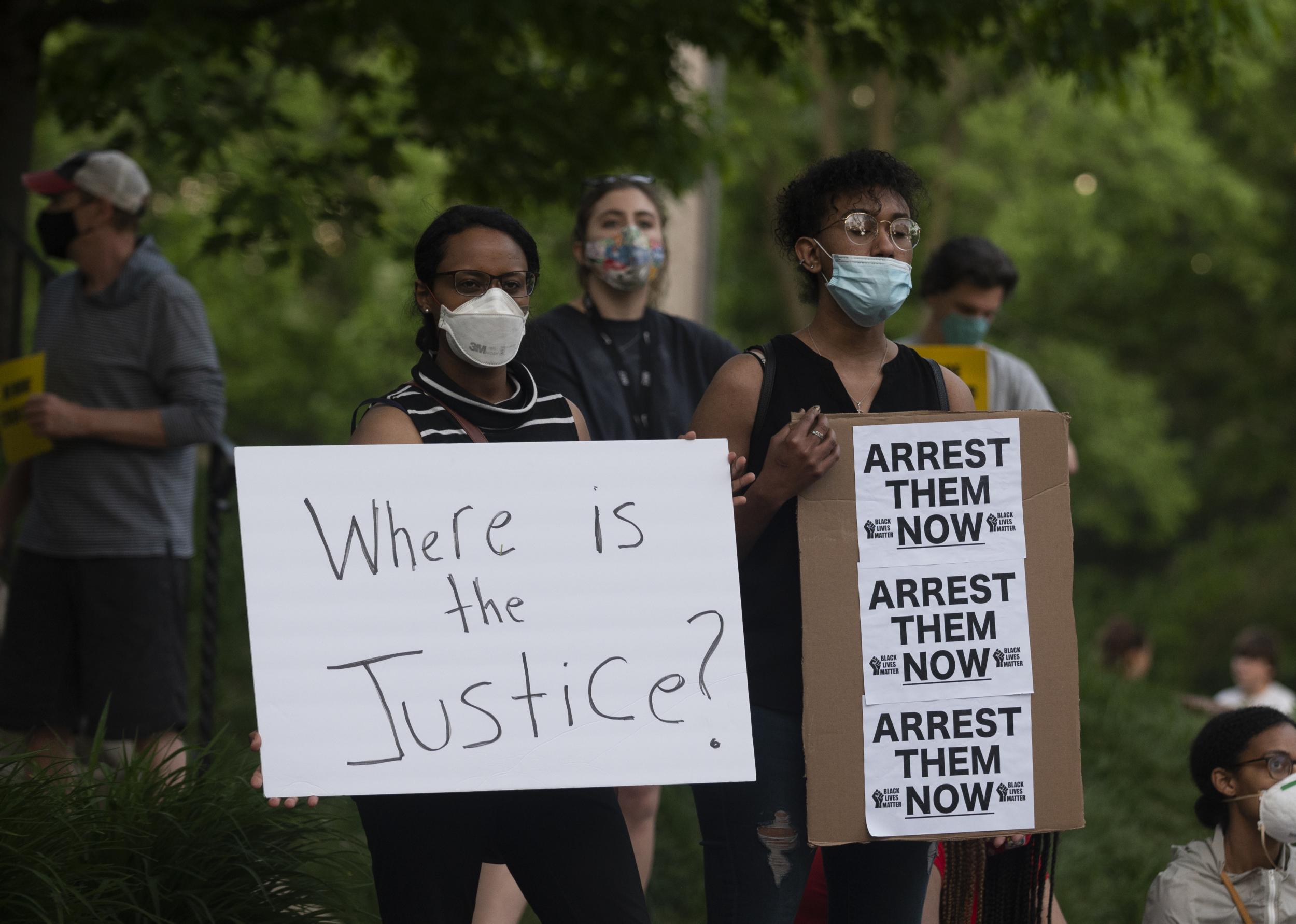 A group of protesters gather outside the home of Hennepin County attorney Mike Freeman