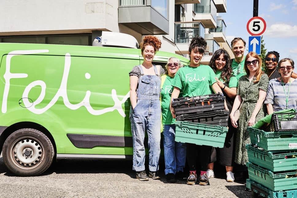 Actor David Morrissey and chef Melissa Hemsley, third from left, help distribute food from The Felix Project before the pandemic