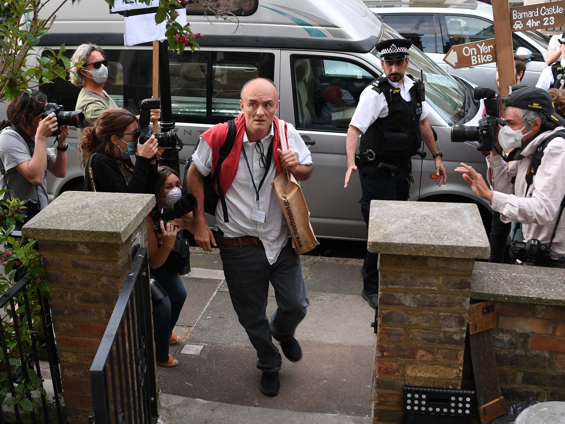 Dominic Cummings arrives at his London home surrounded by photographers