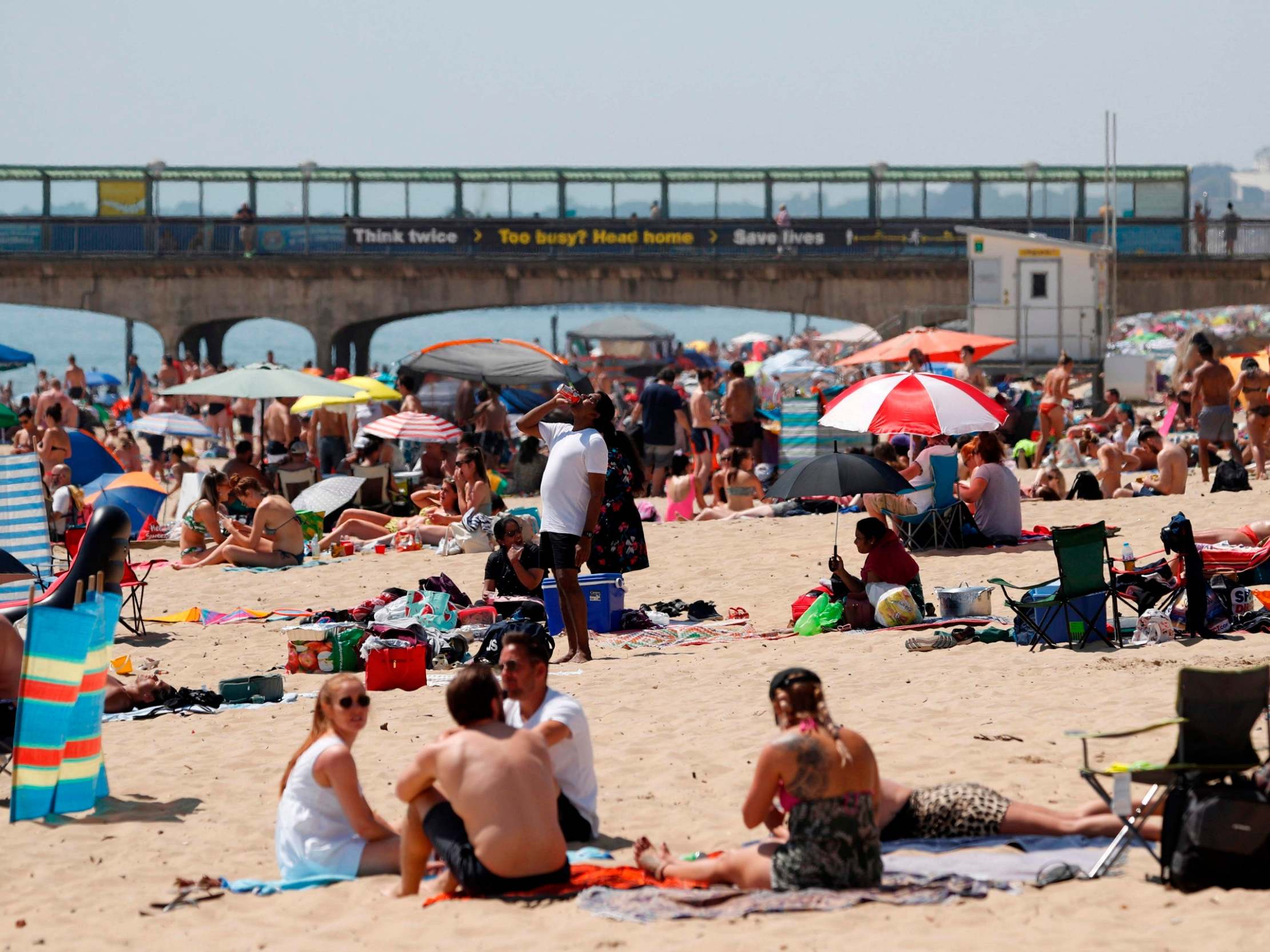 Sunbathers enjoy the sunny weather on Boscombe beach (AFP/Getty)