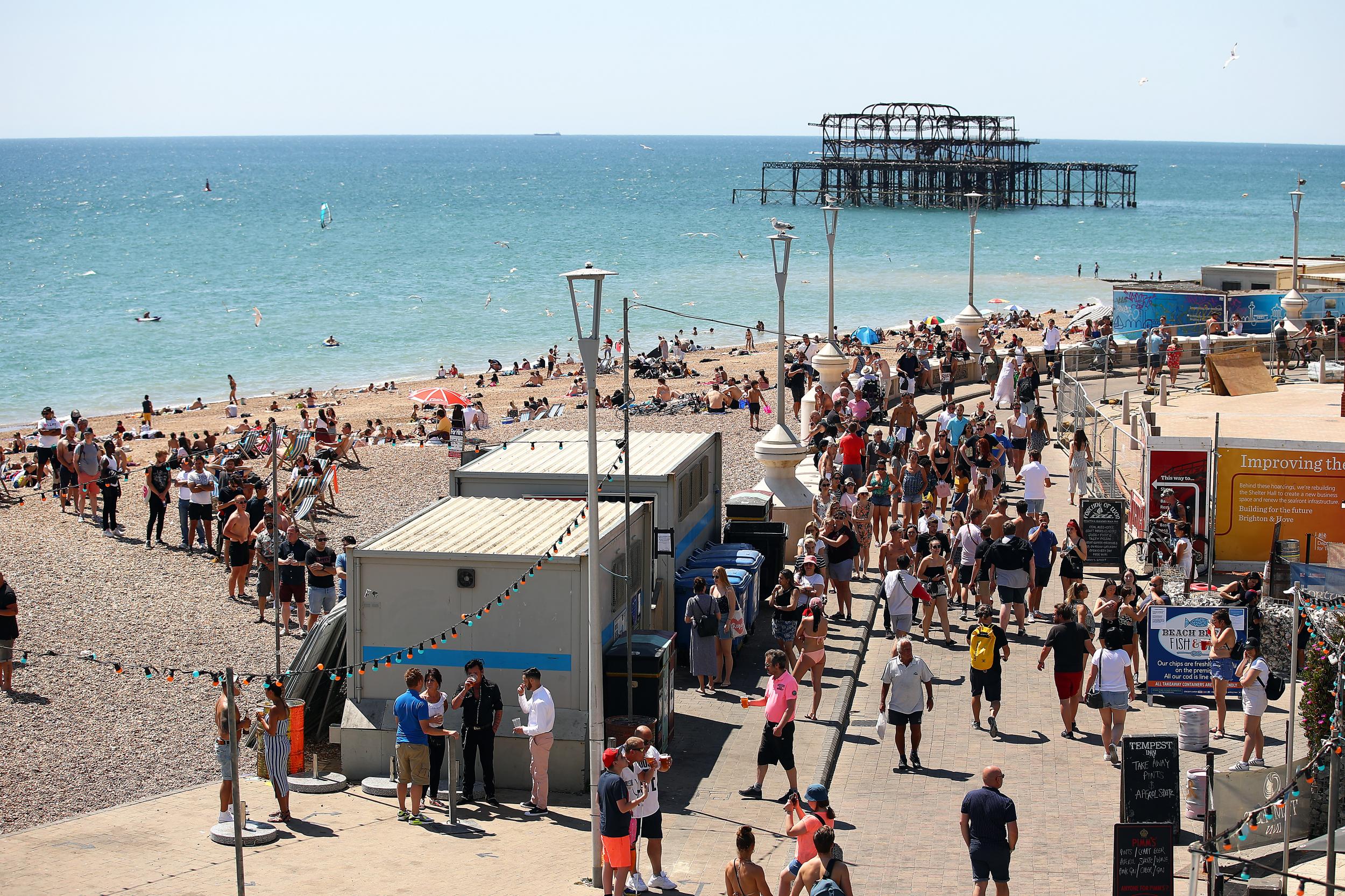 People queue for the toilet on Brighton beach (Getty)