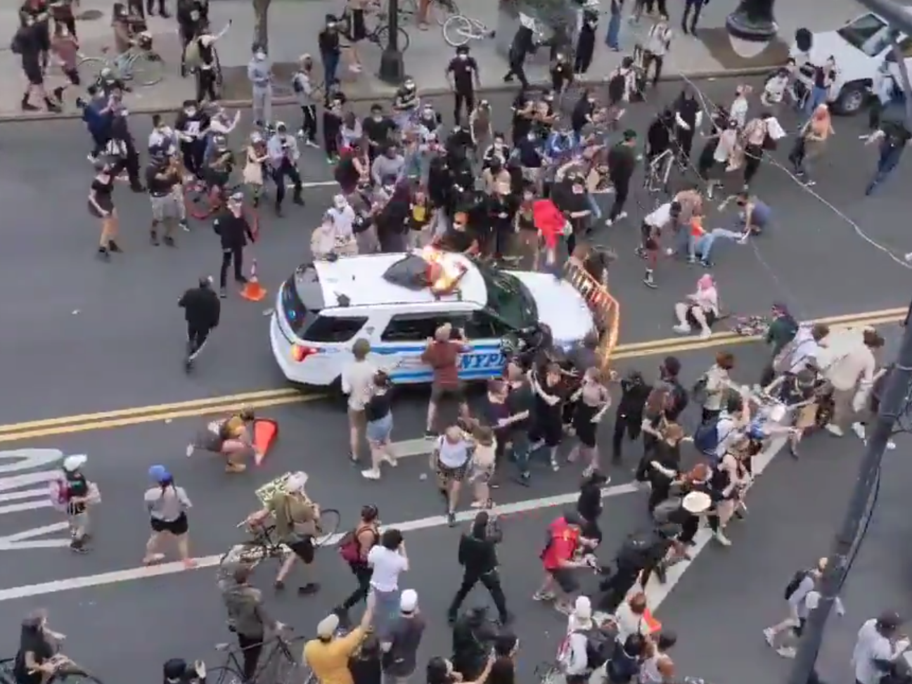 A NYPD rams into a crowd of protesters in Brooklyn on 30 May, 2020