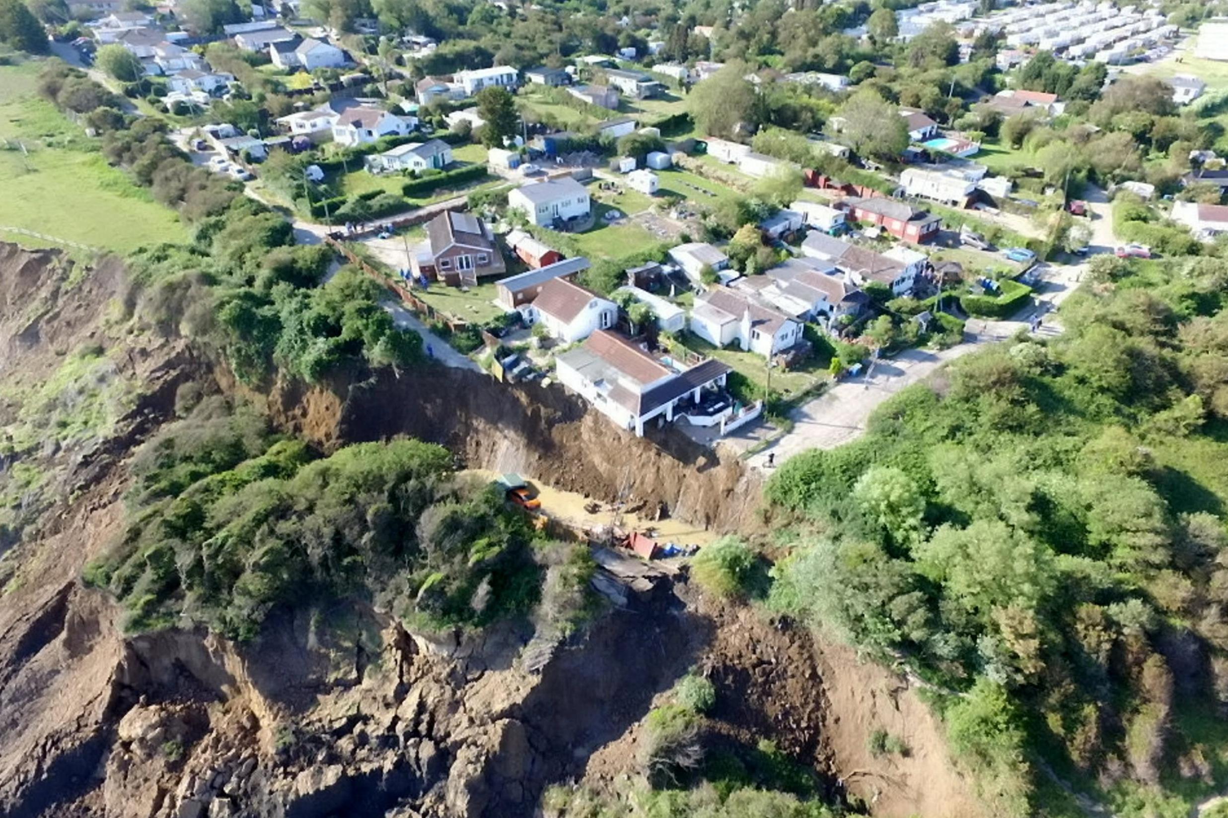 A house in Eastchurch, Kent, hangs over a cliff.