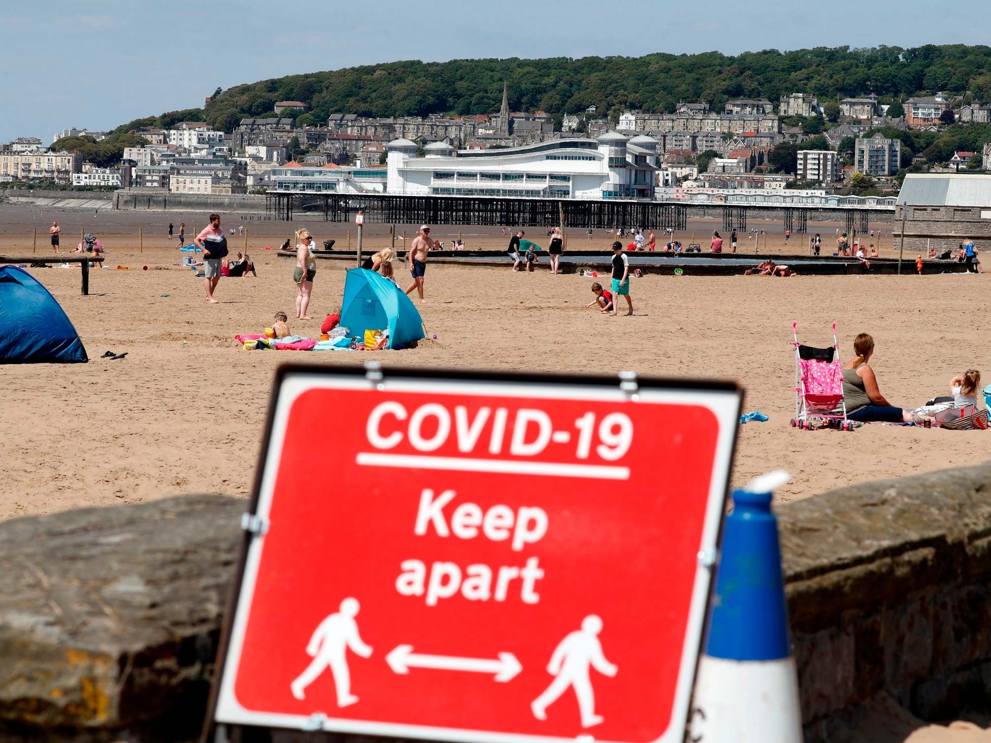 A sign displaying advice on social distancing on a beach in Weston-super-Mare (AFP/Getty)