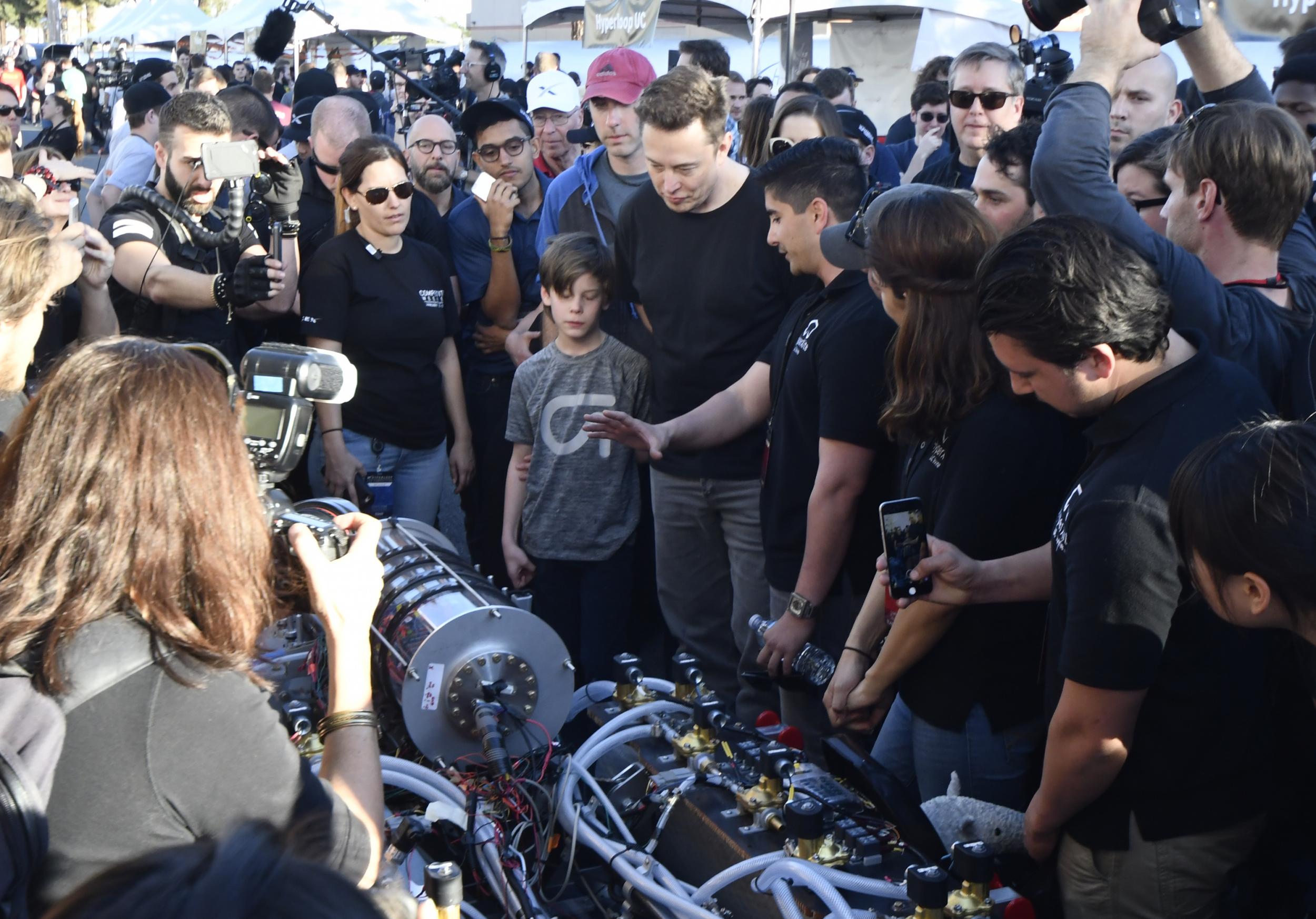 Elon Musk inspects a student’s design during the SpaceX Hyperloop Pod Competition in California in 2017