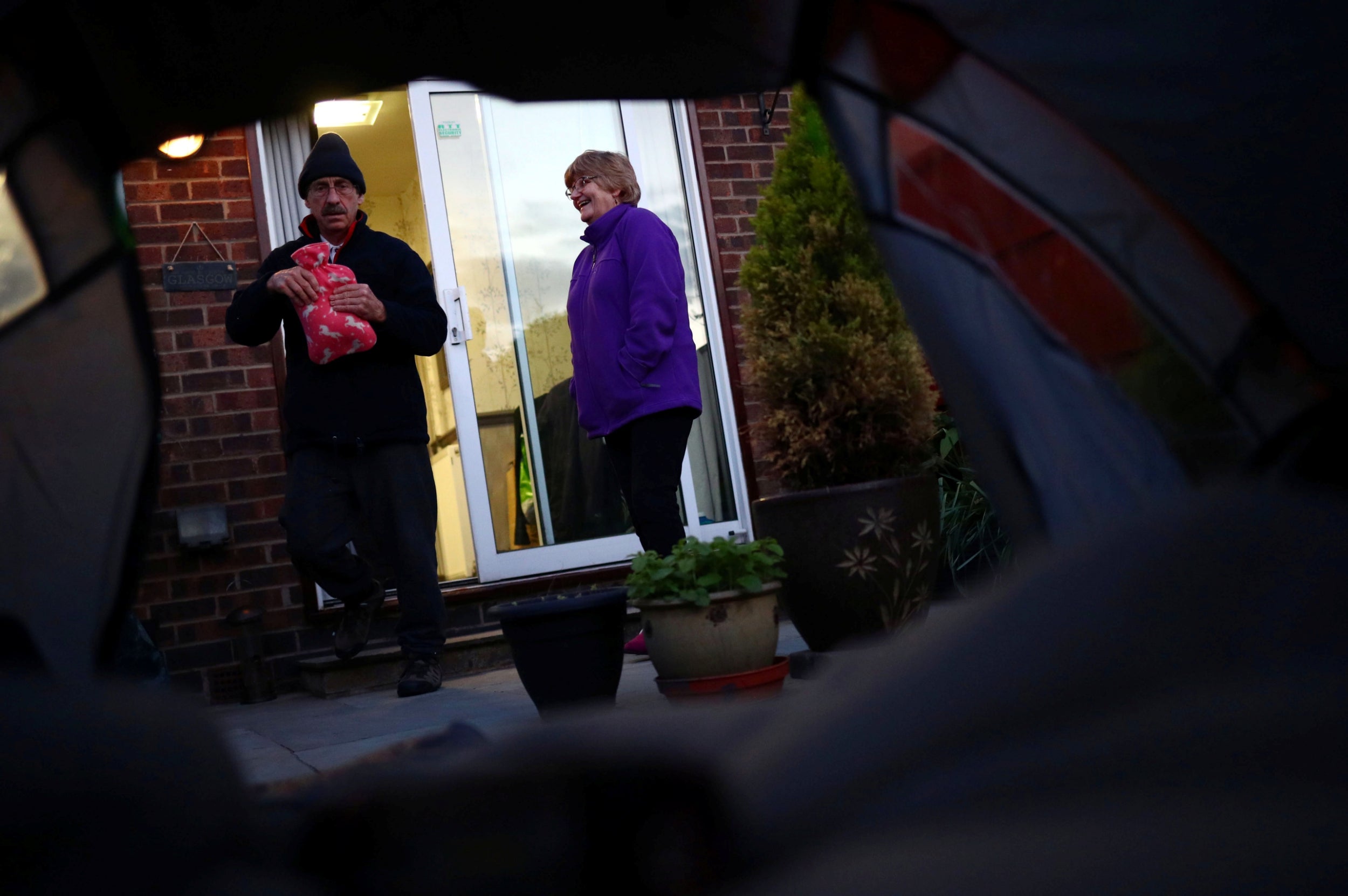 Hannah’s father Jim carries a hot water bottle to her tent