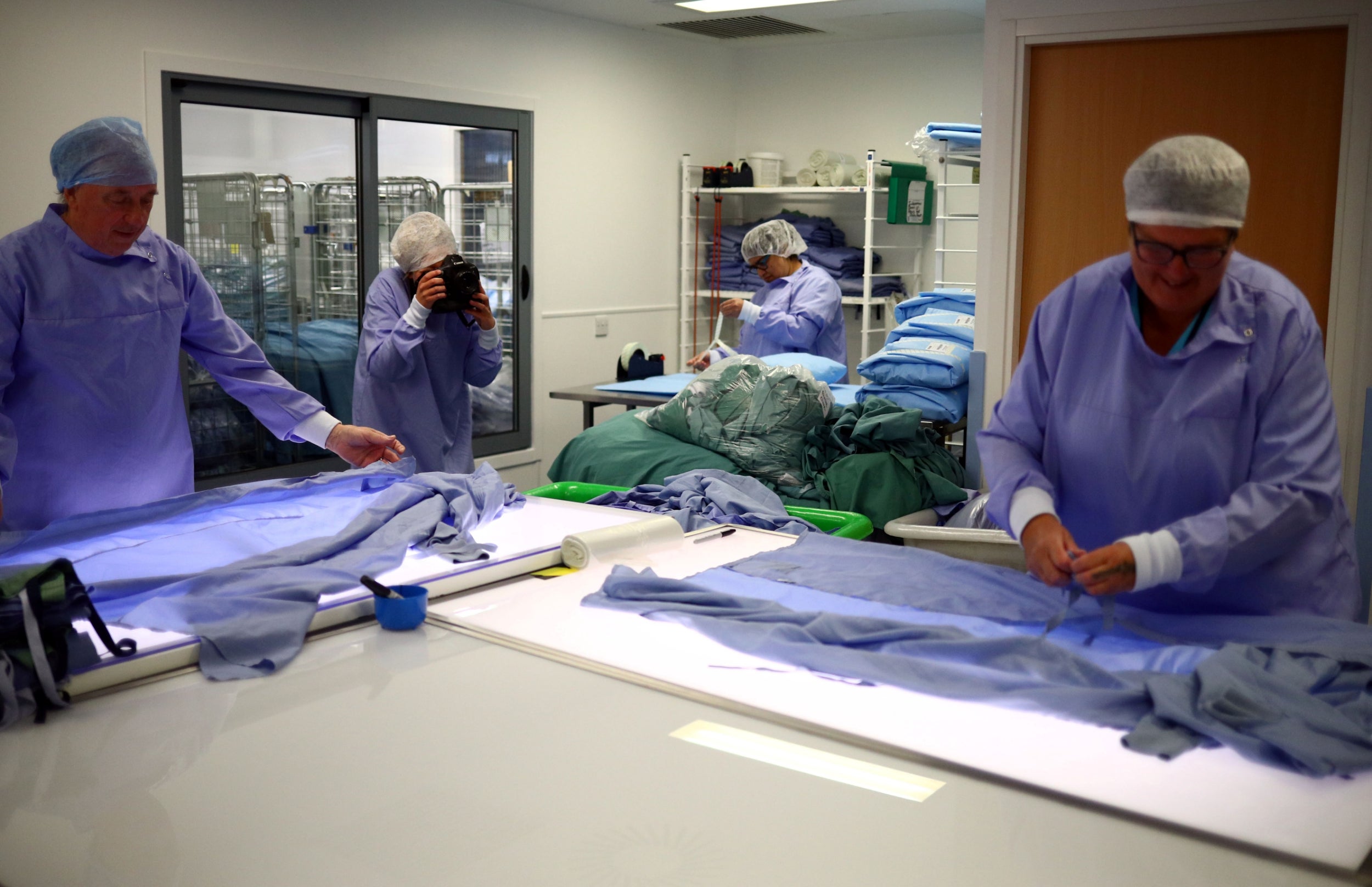 Photographing workers in the linen and laundry room