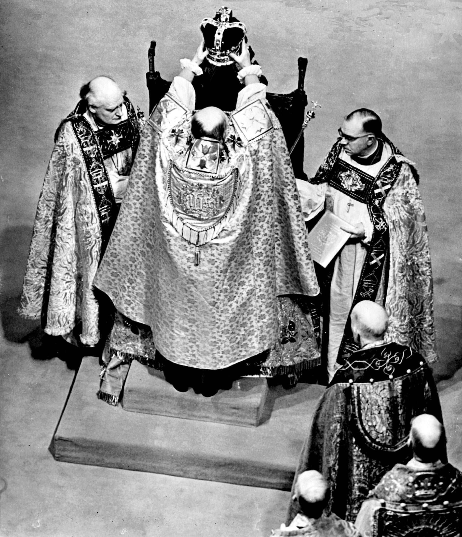 The Queen sits on the St Edwards Chair as she is crowned by the Archbishop of Canterbury