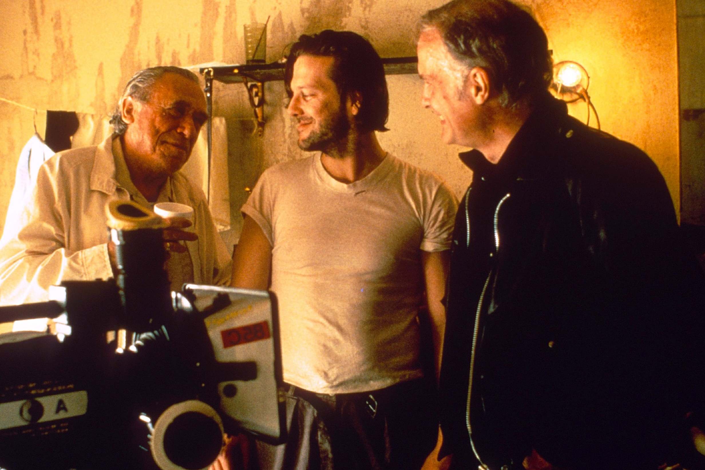 The writer on the set of ‘Barfly’, with star Mickey Rourke and director Barbet Schroeder