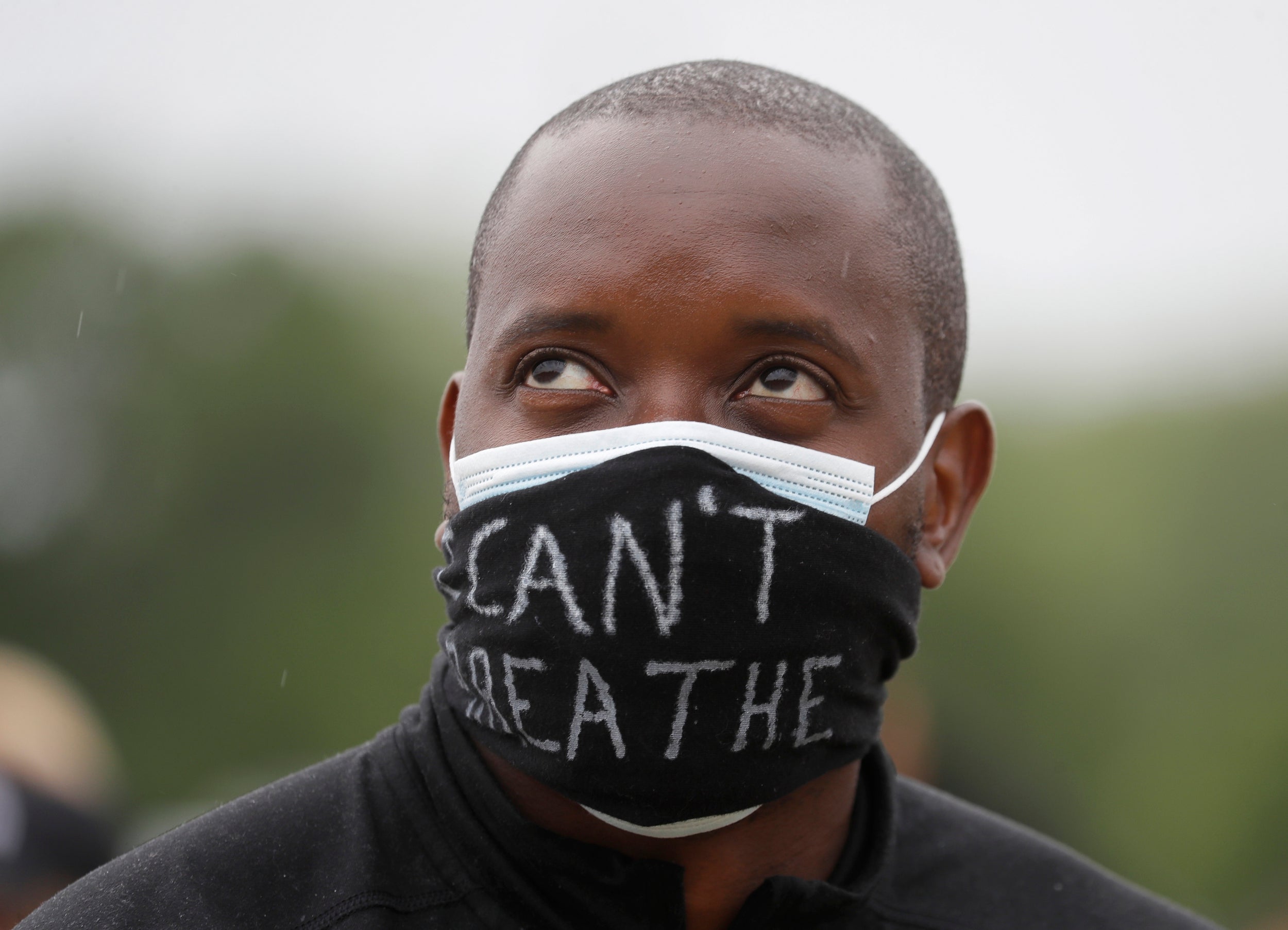 A protester in Hyde Park wears a mask saying, ‘I can’t breathe’ – among George Floyd’s final words