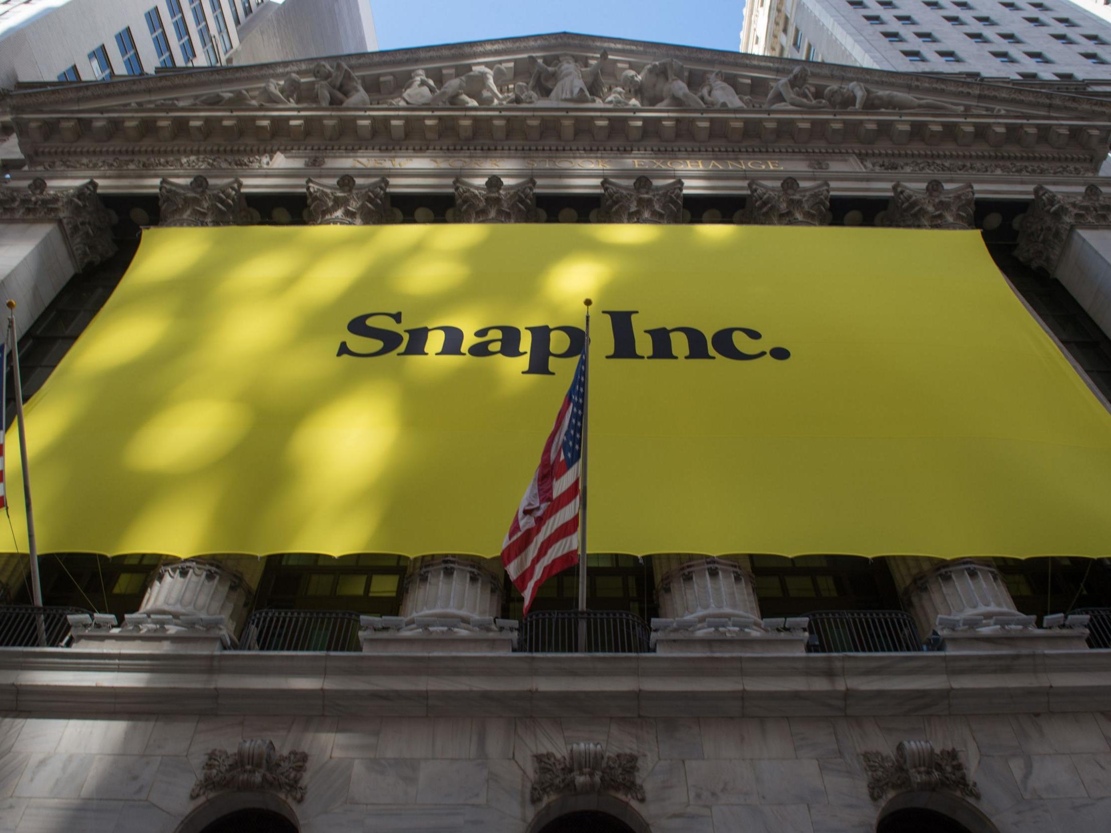 a Snap Inc. banner covers the facade of the New York Stock Exchange in New York, as the Snapchat IPO debuts