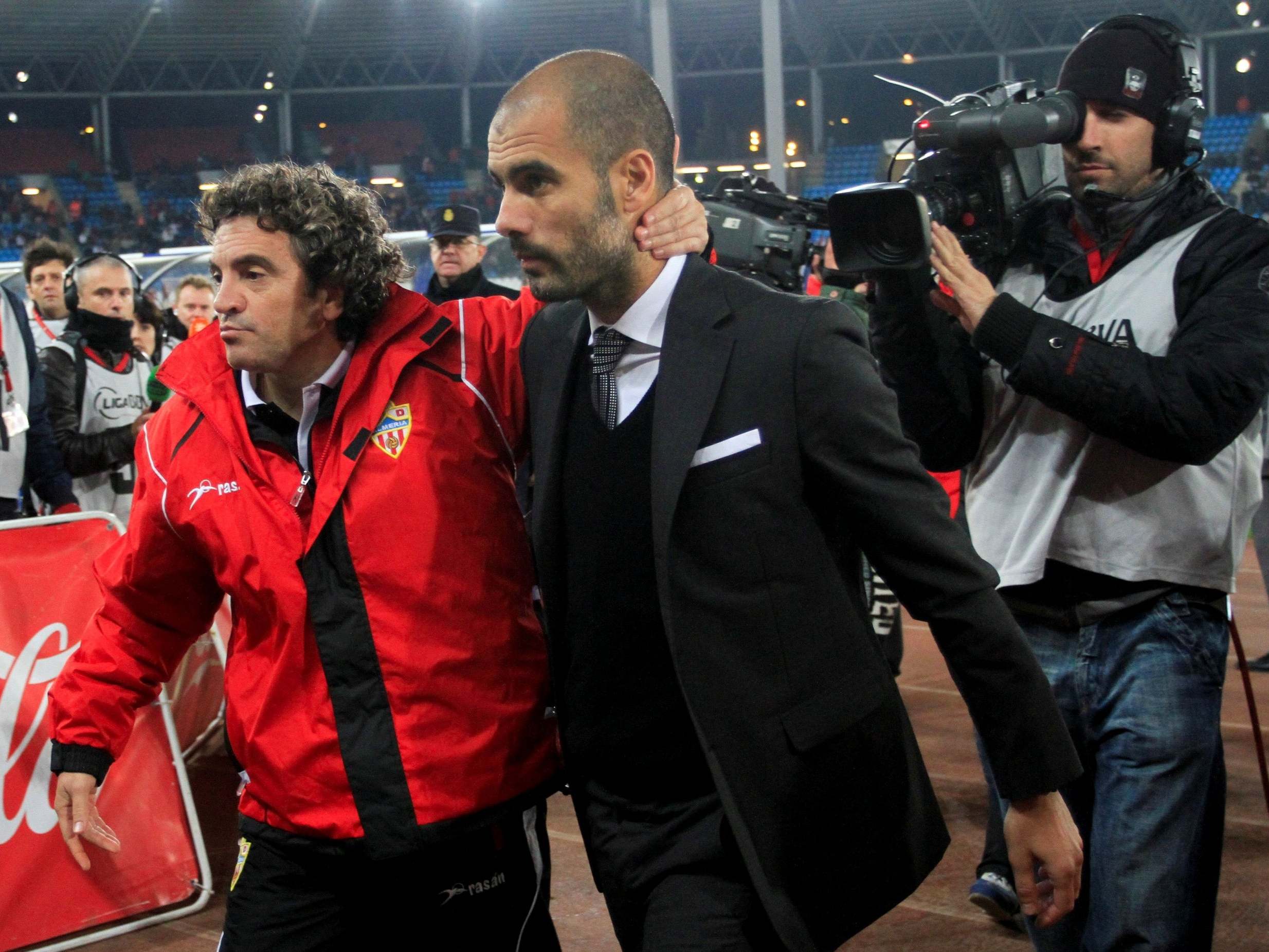 The then-Almeria coach Juanma Lillo, left, with Pep Guardiola