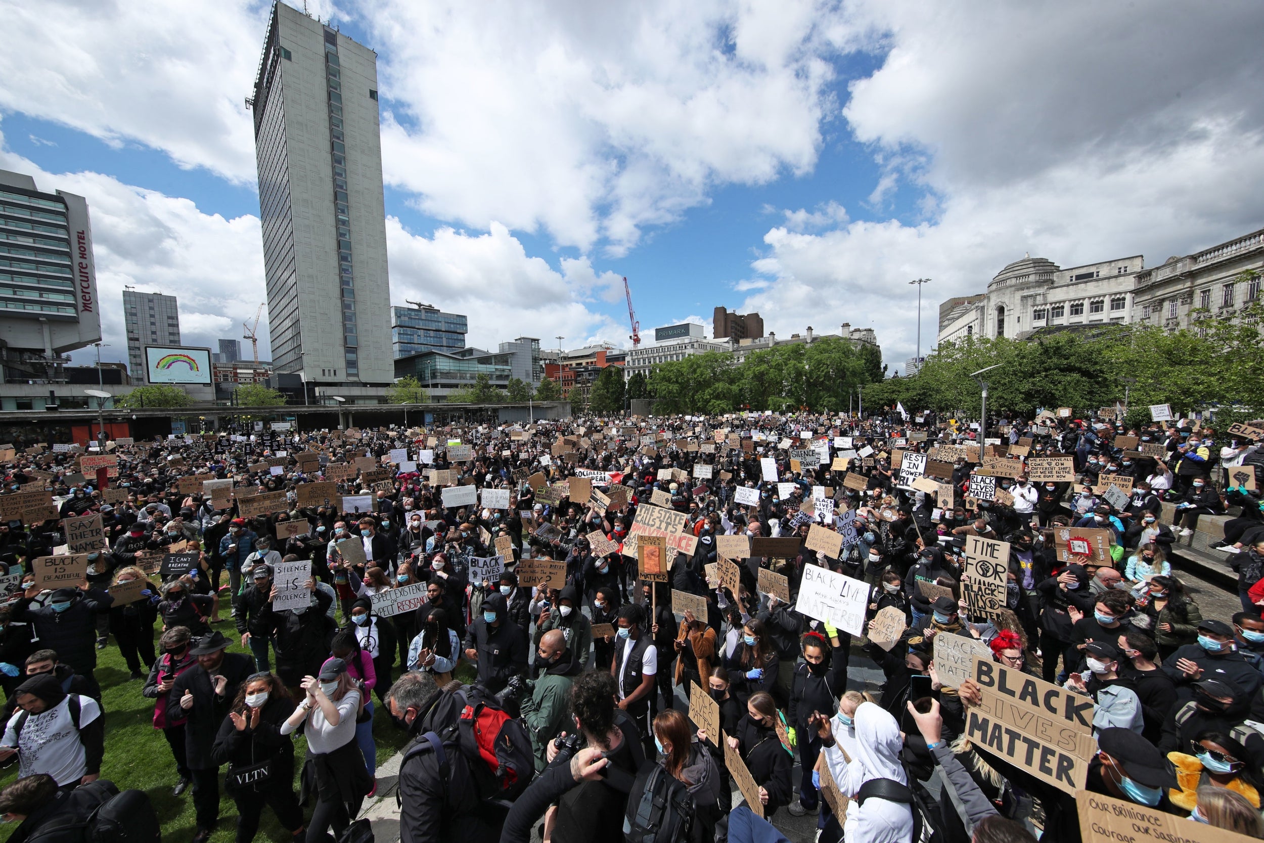 People take part in a Black Lives Matter protest rally in Manchester Piccadilly Gardens